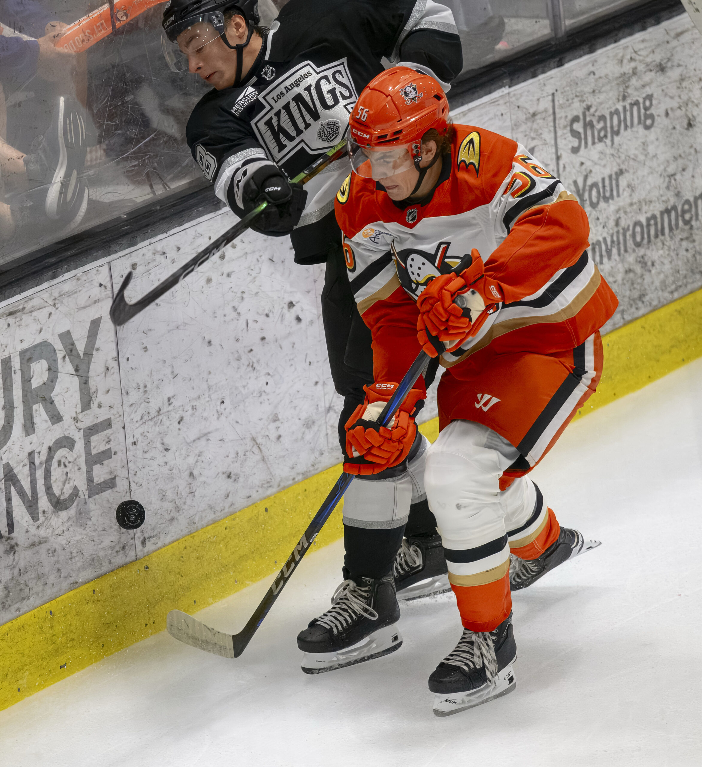 The Kings’ Henry Brzustewicz, left, and the Ducks’ Maxim Masse...