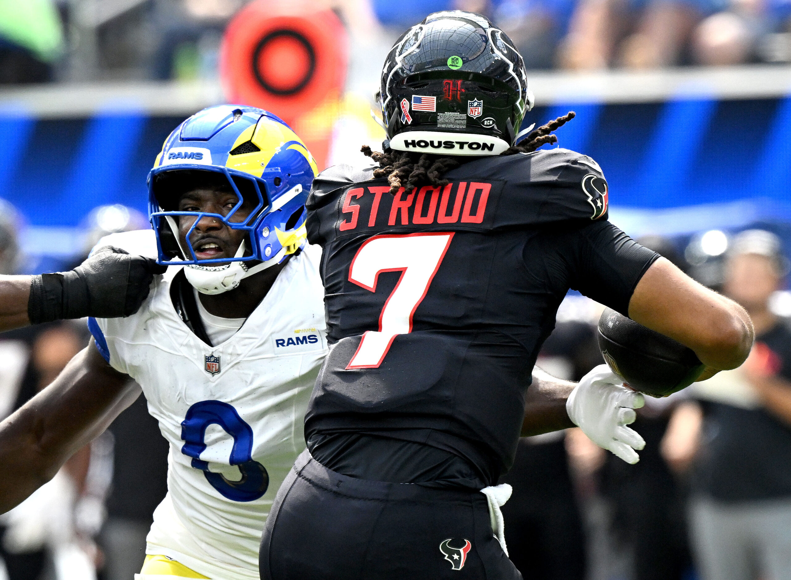 Rams Byron Young moves in to sack Houston quarterback C.J....