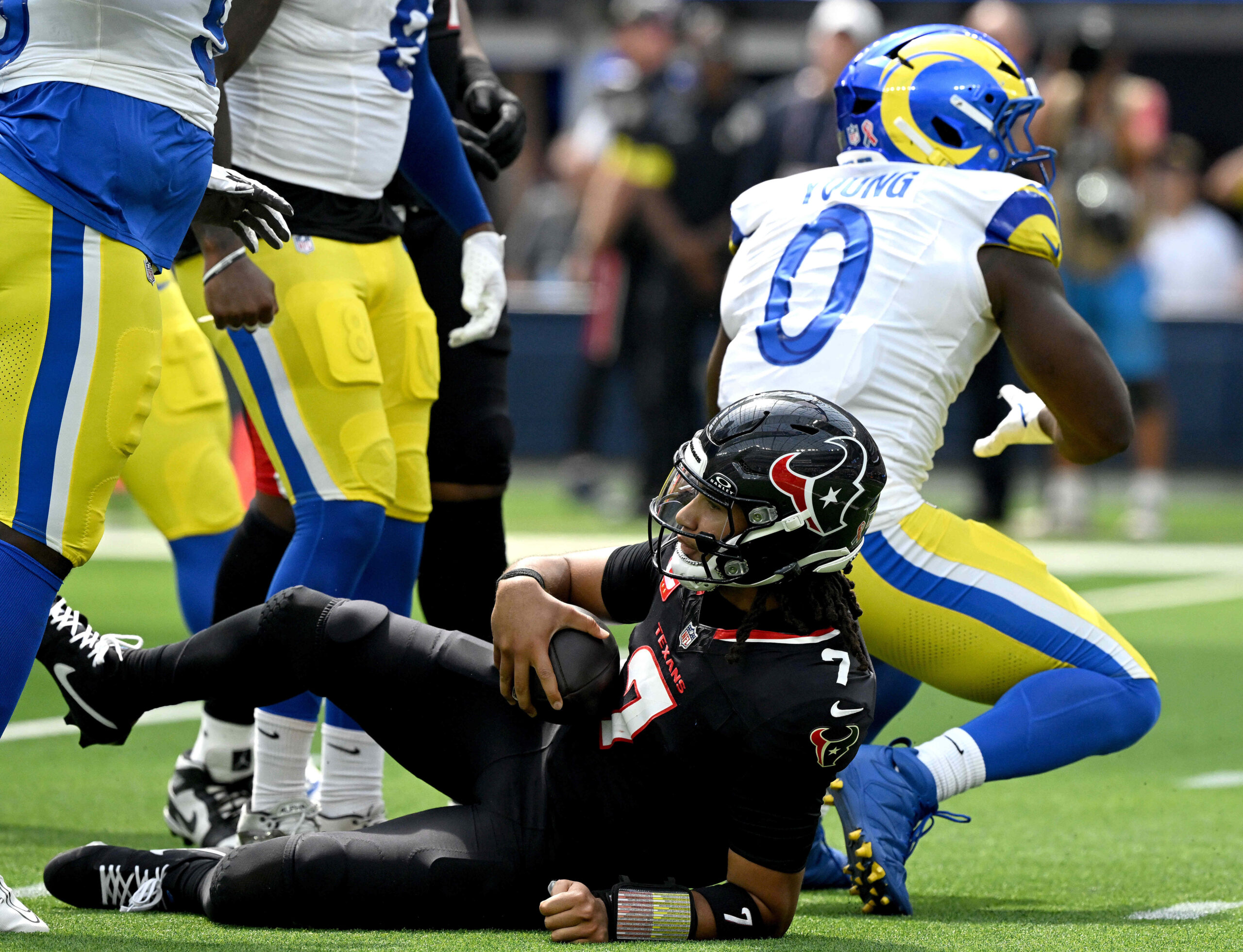 The Rams Byron Young sacks Houston quarterback C.J. Stroud during...
