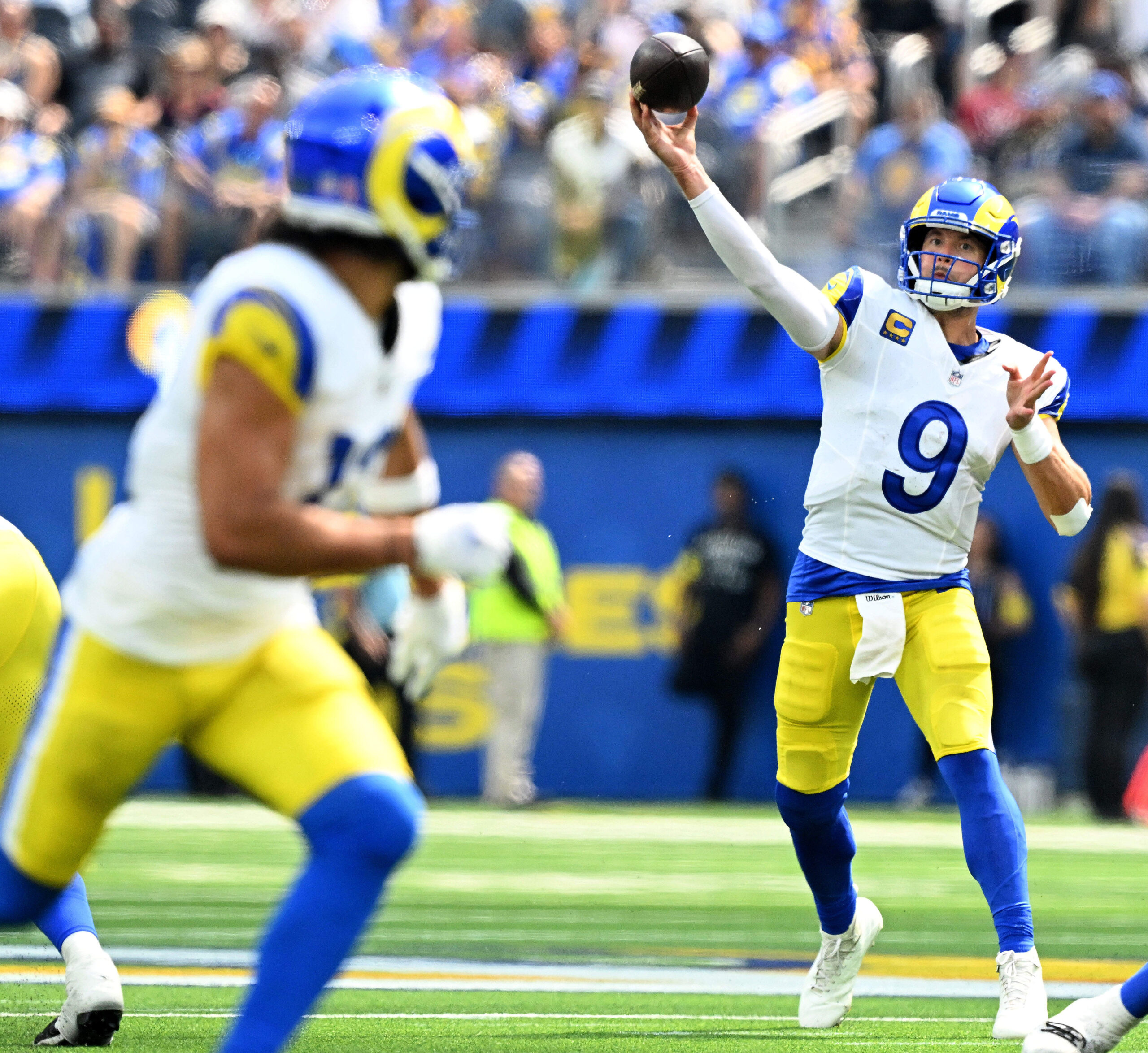 Rams quarterback Matthew Stafford throws down field to receiver Puka...