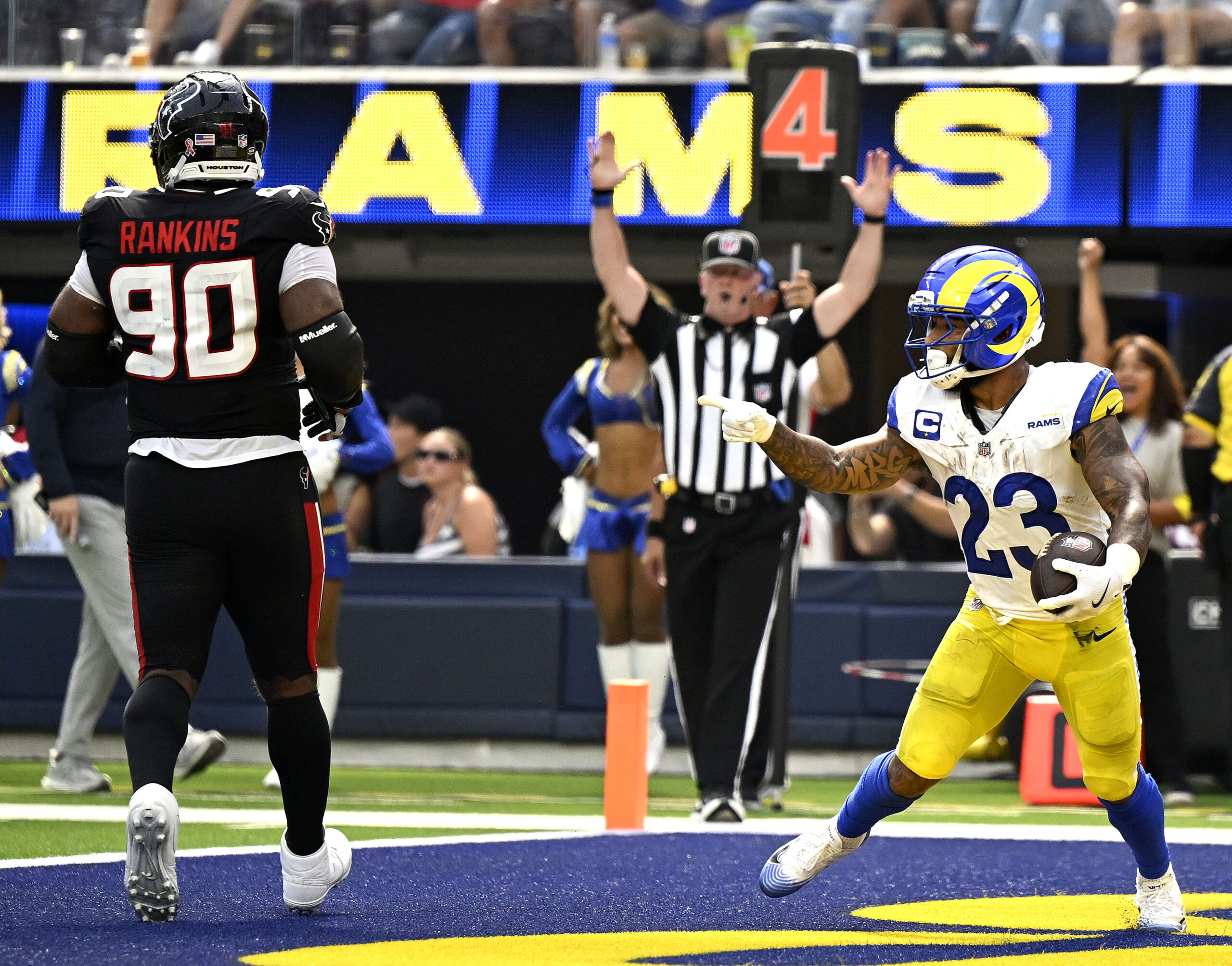 The Rams Kyren Williams celebrates after scoring against the visiting...