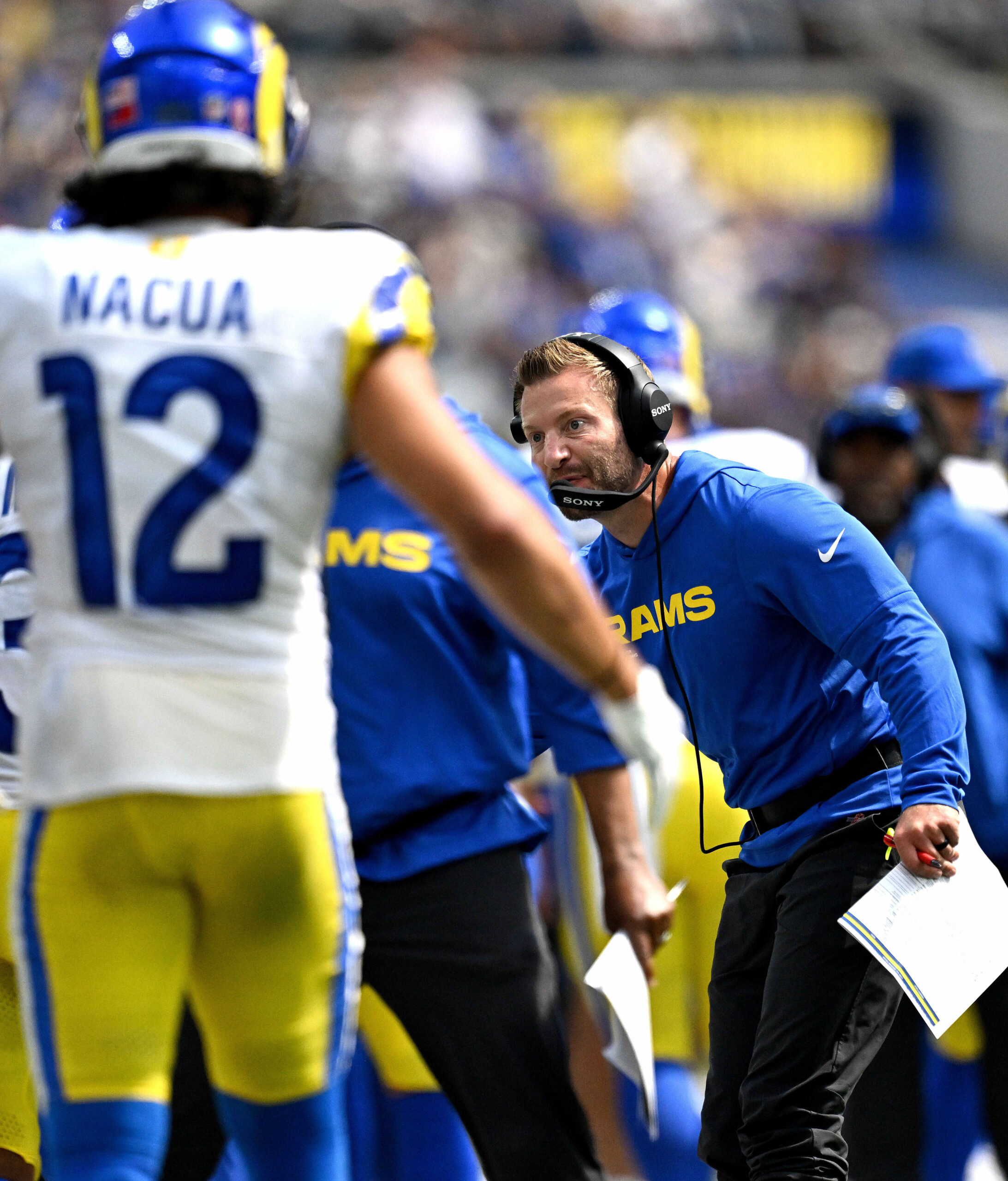Rams head coach Sean McVay celebrates with players after scoring...