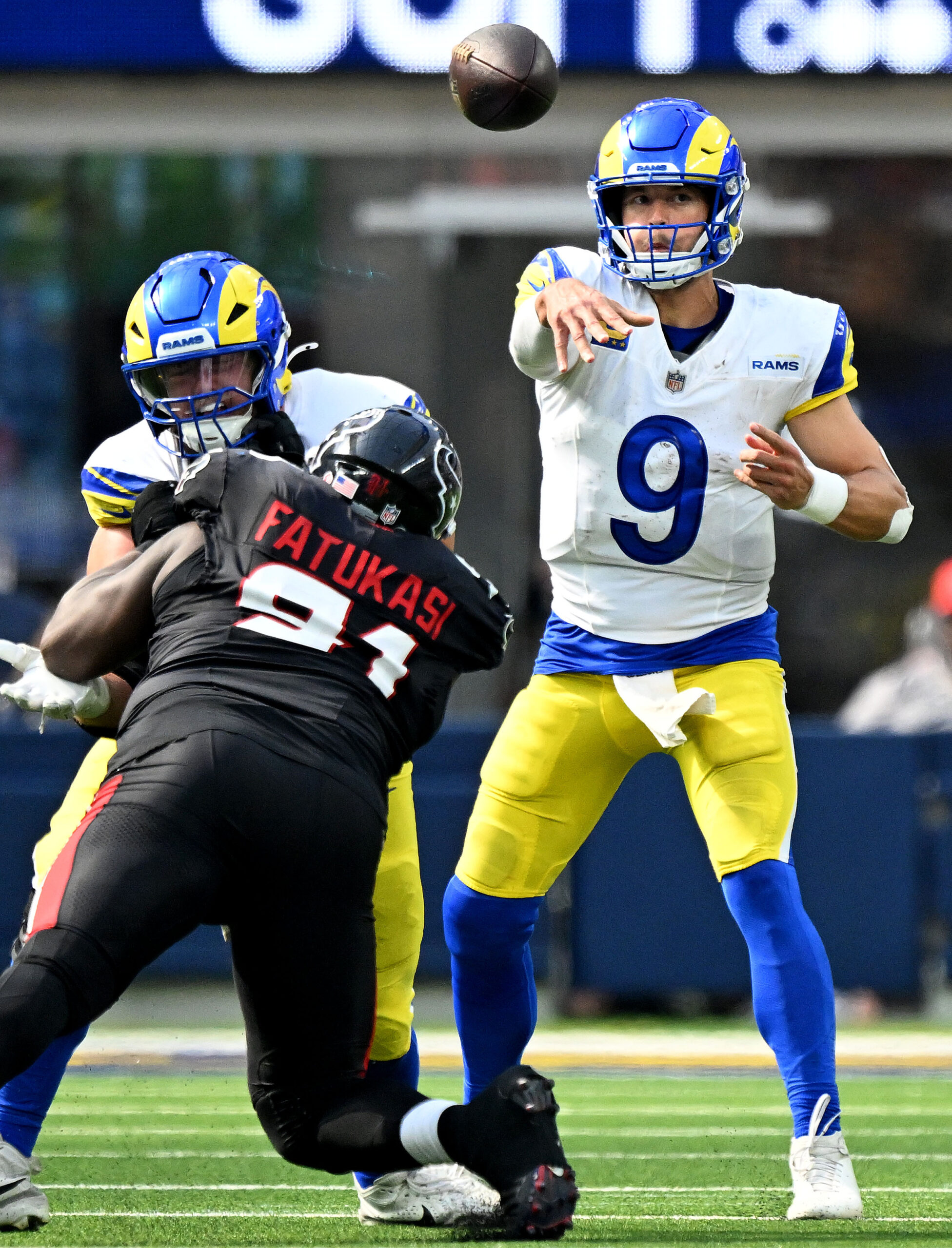 Rams quarterback Matthew Stafford throws up field against the Houston...