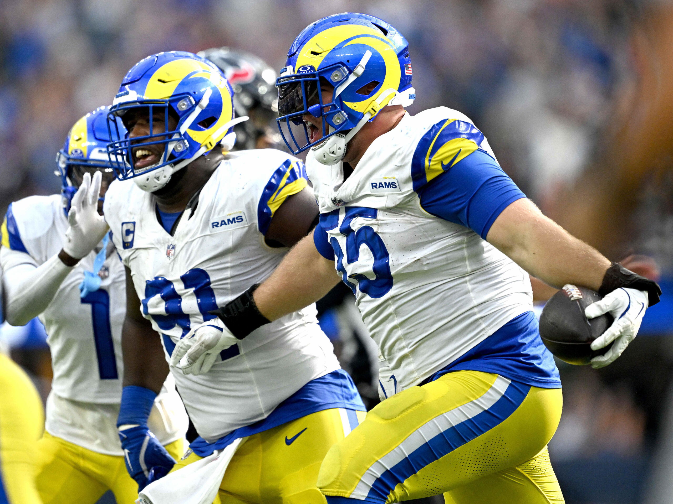 Rams defensive end Braden Fiske, right, celebrates with teammate Kobie...