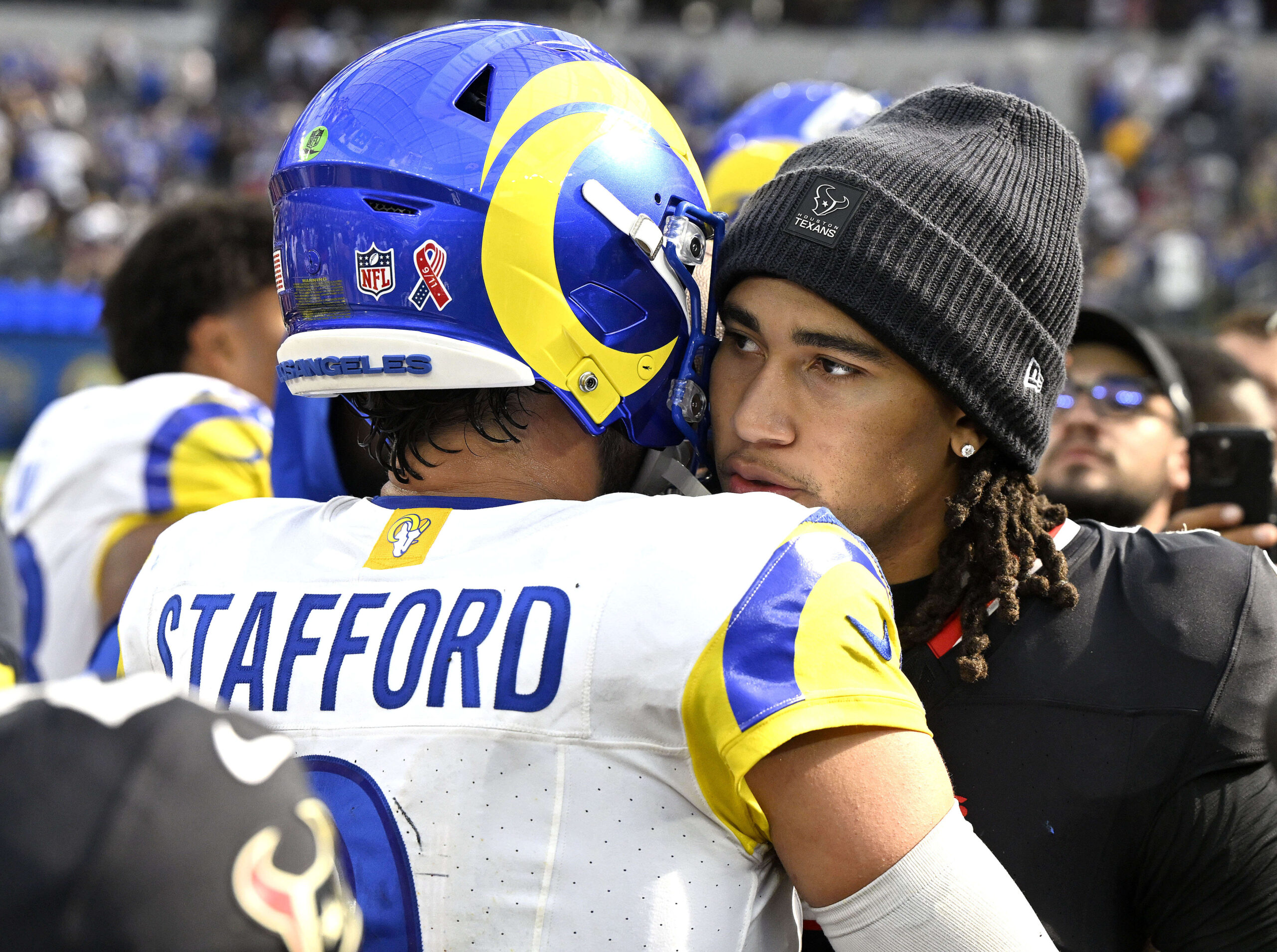 Rams quarterback Matthew Stafford speaks with Houston Texans quarterback C.J....