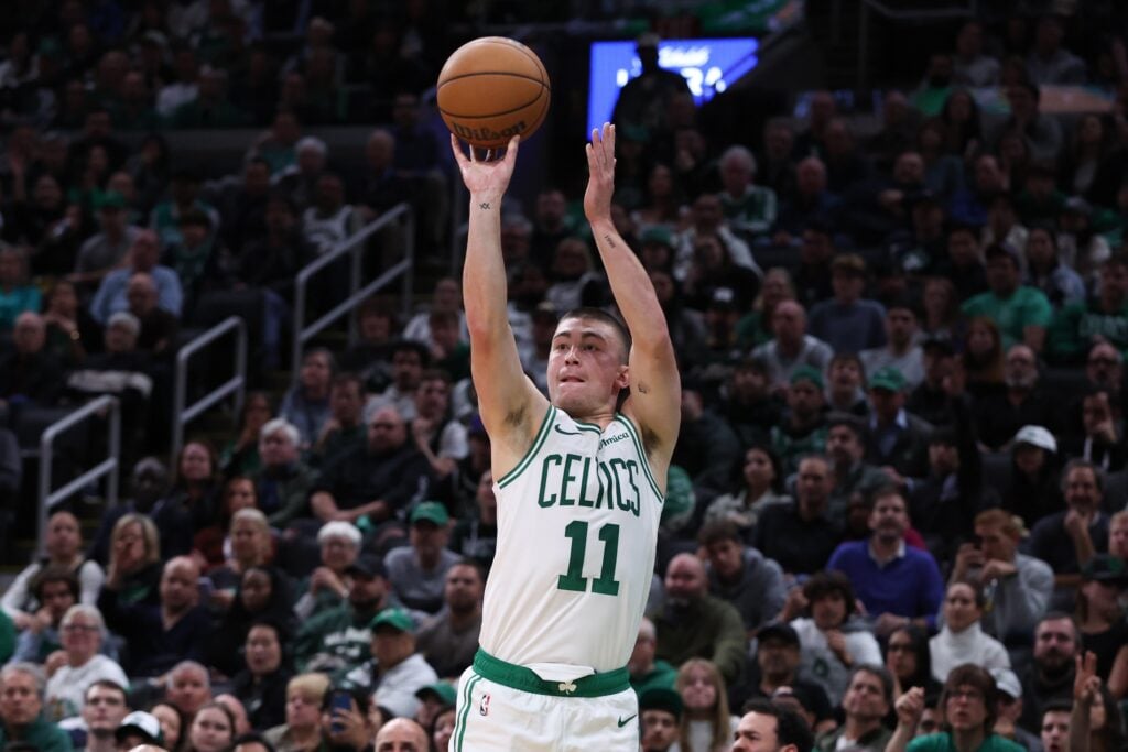 Boston Celtics guard Payton Pritchard (11) shoots during the second half against the Milwaukee Bucks at TD Garden.