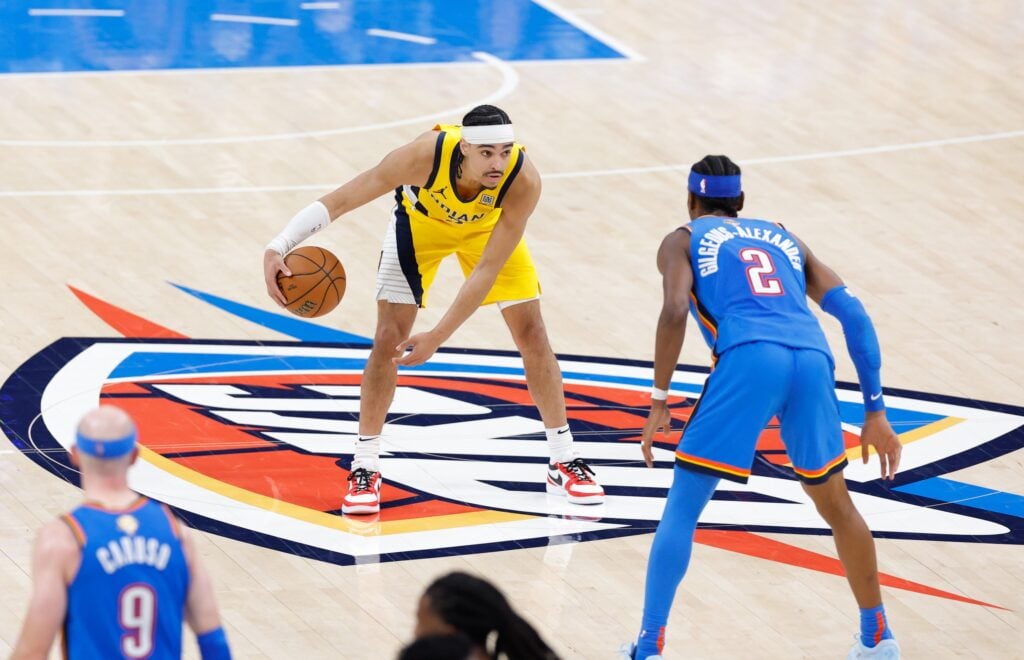 Jun 22, 2025; Oklahoma City, Oklahoma, USA; Indiana Pacers guard Andrew Nembhard (2) dribbles the ball as Oklahoma City Thunder guard Shai Gilgeous-Alexander (2) defends during the second half of game seven of the 2025 NBA Finals at Paycom Center. Mandatory Credit: Alonzo Adams-Imagn Images