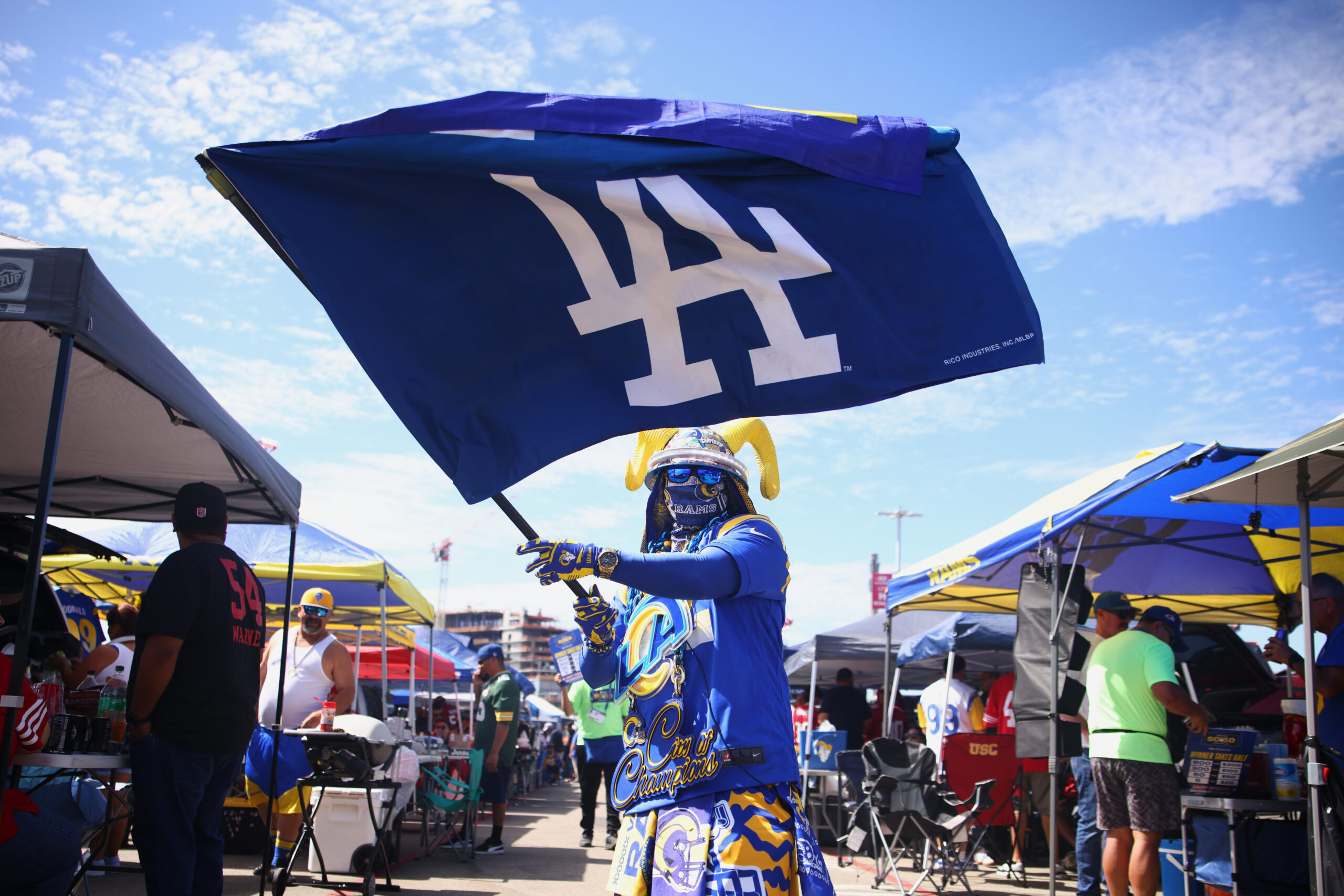 Fans tailgate before a game between the Rams and the...