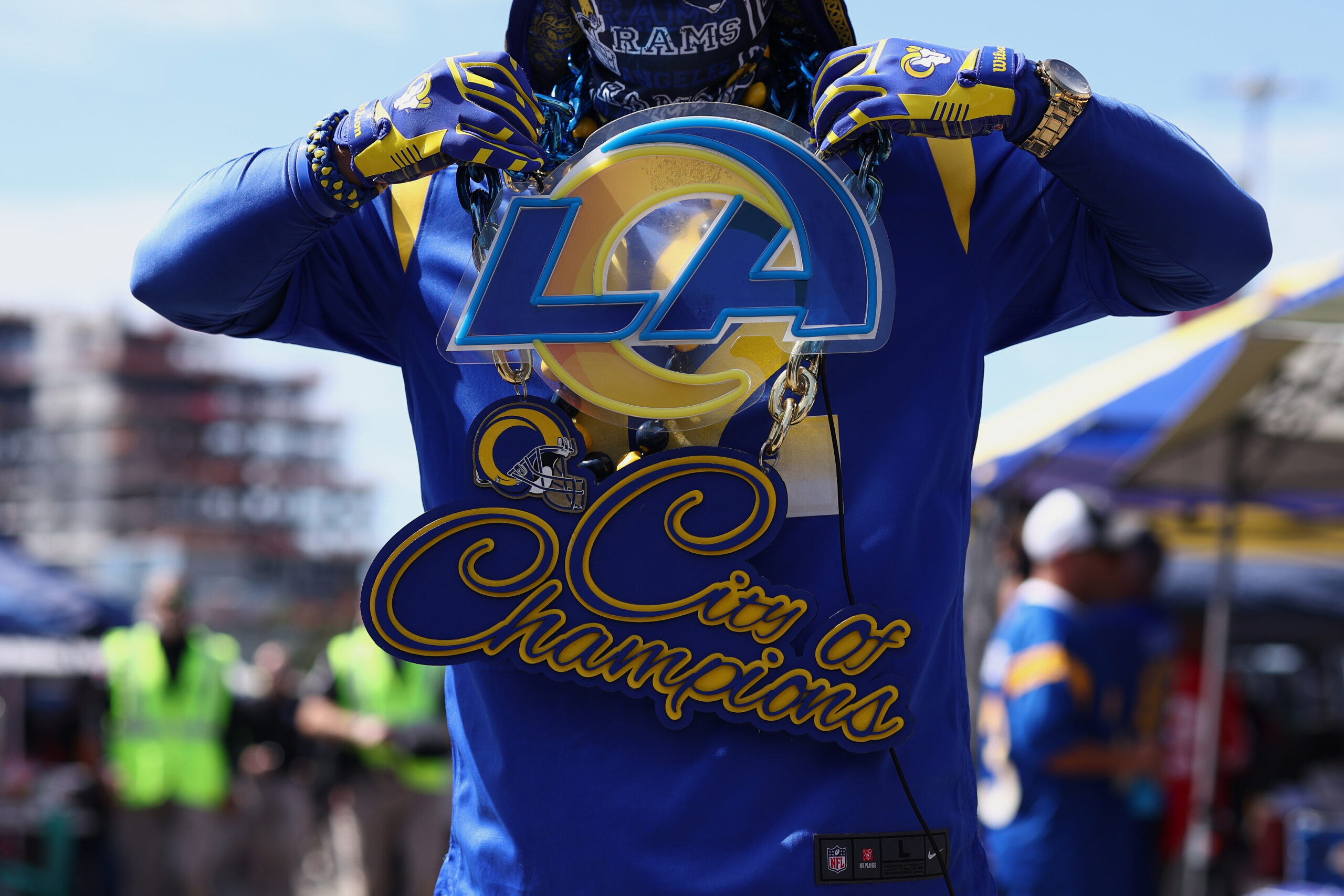 Fans tailgate before a game between the Rams and the...