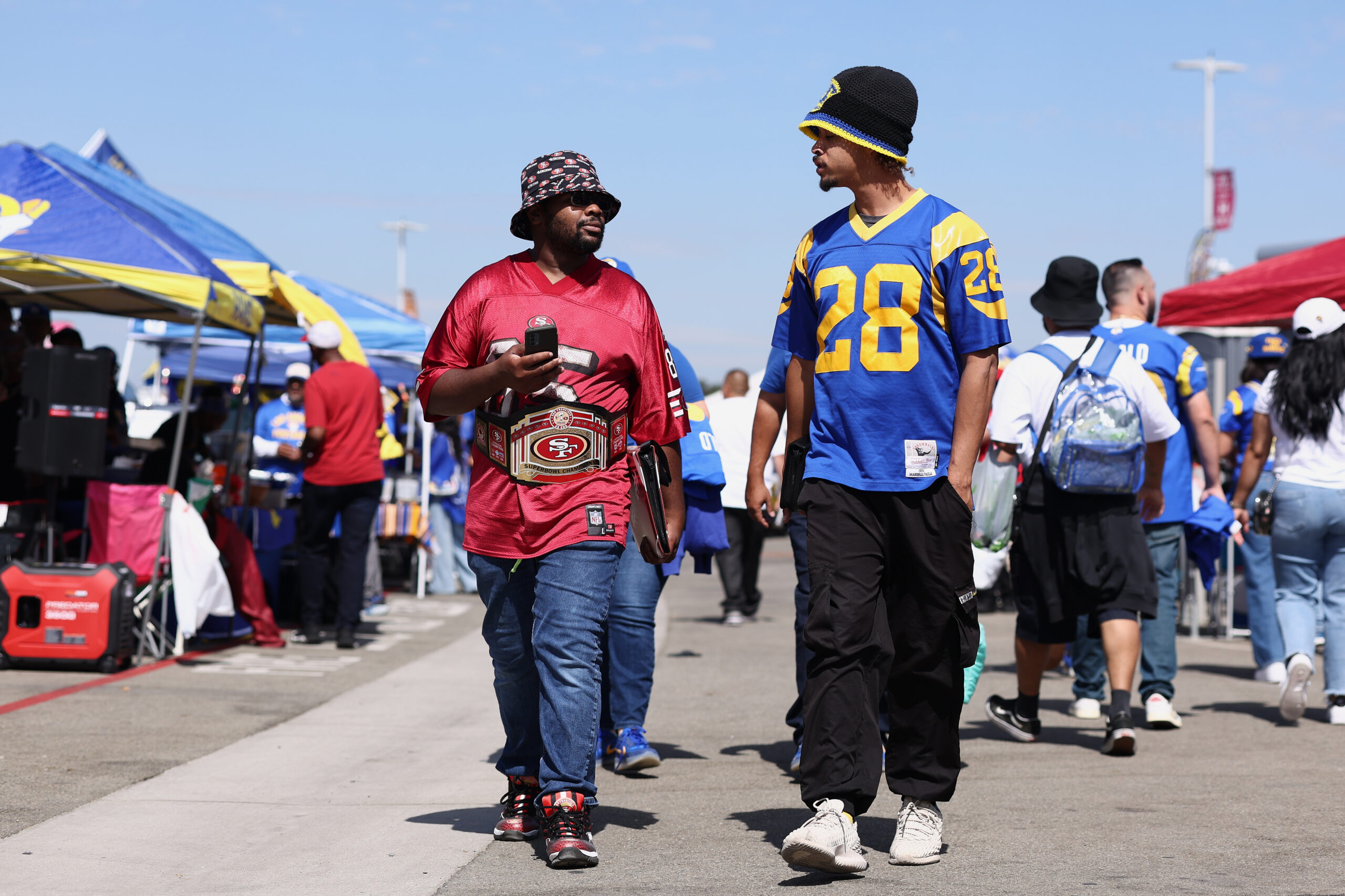 Fans tailgate before an NFL football game between the Rams...