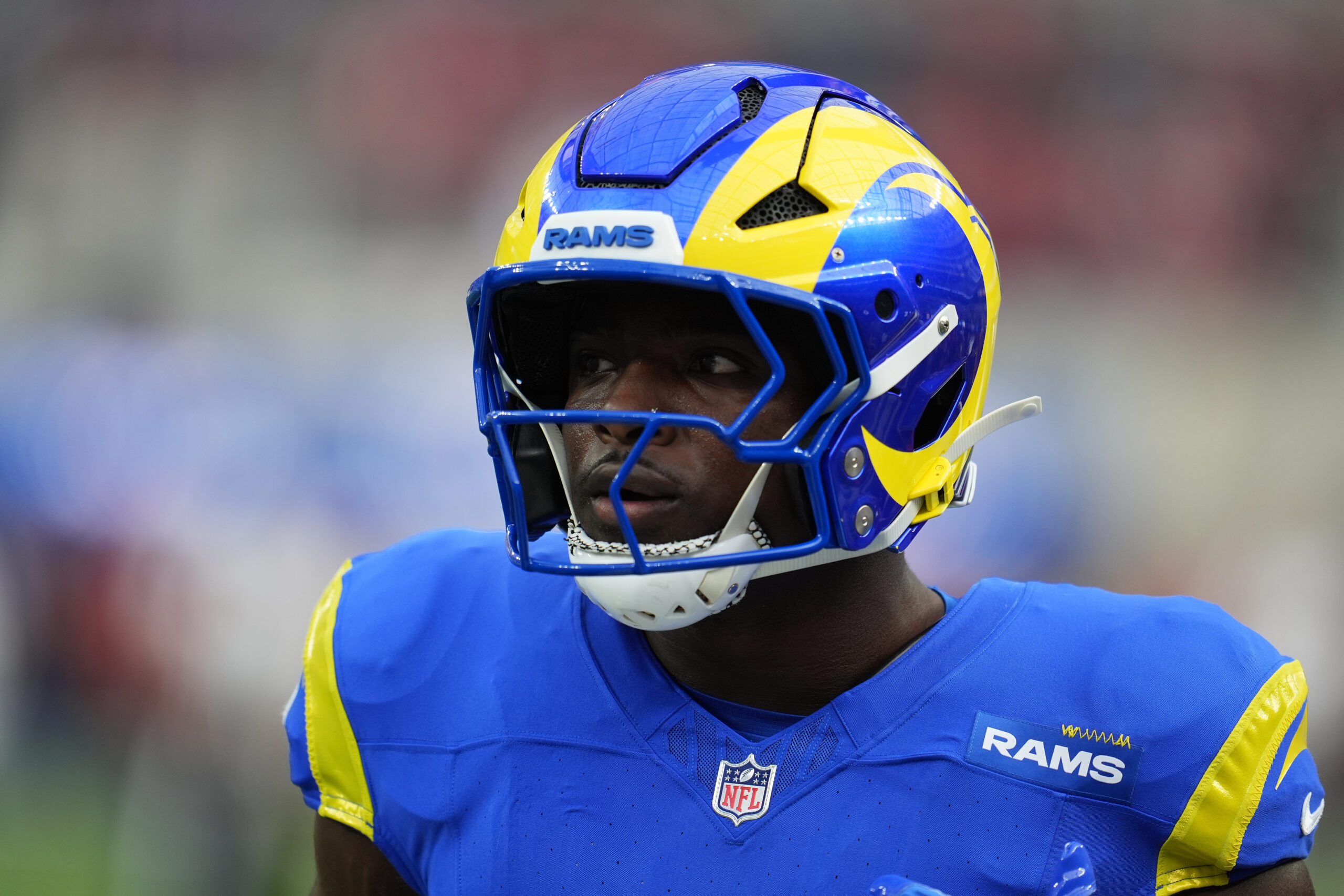 Rams linebacker Jared Verse warms up before an NFL football...