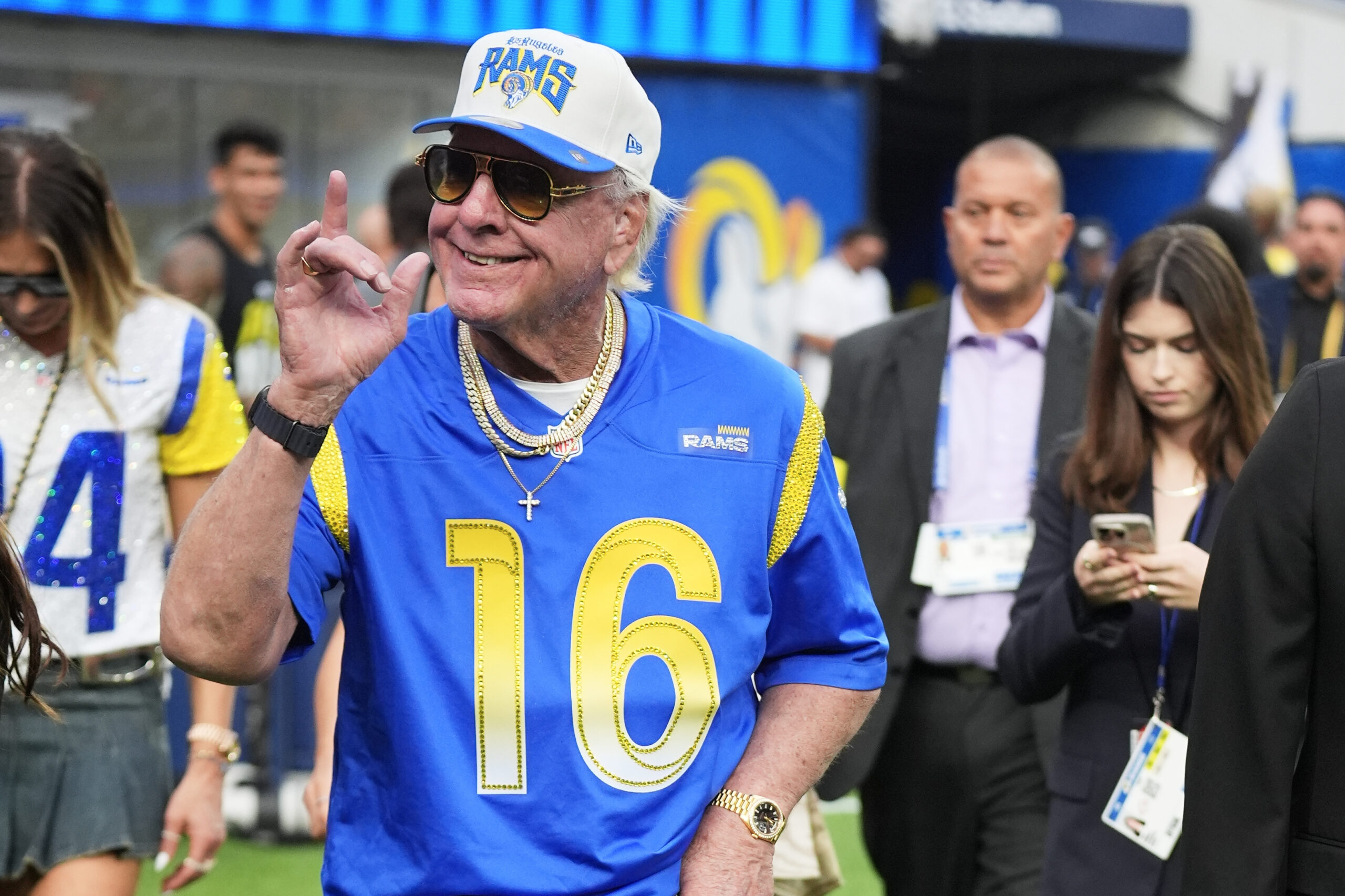 Professional wrestler Ric Flair walks on the field before a...