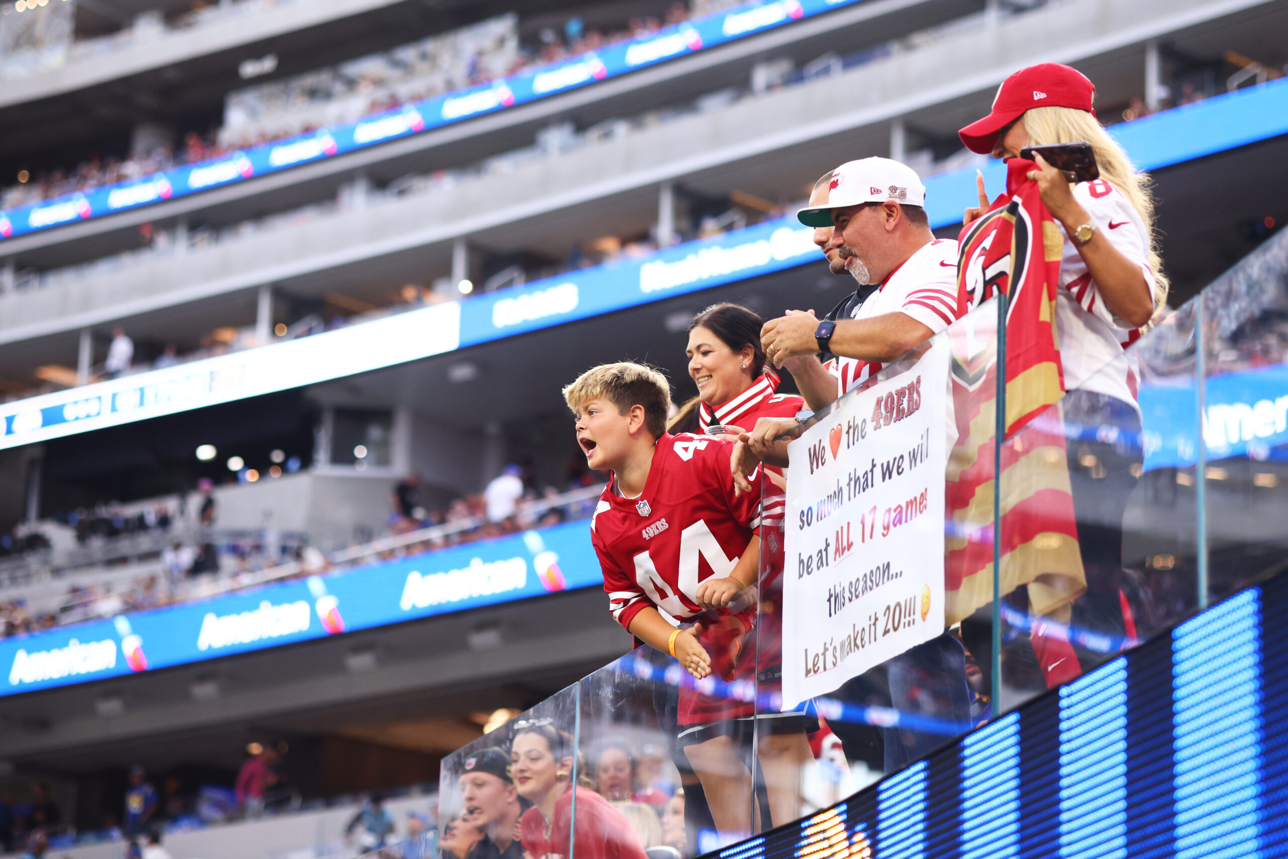 Fans cheer before an NFL football game between the Rams...