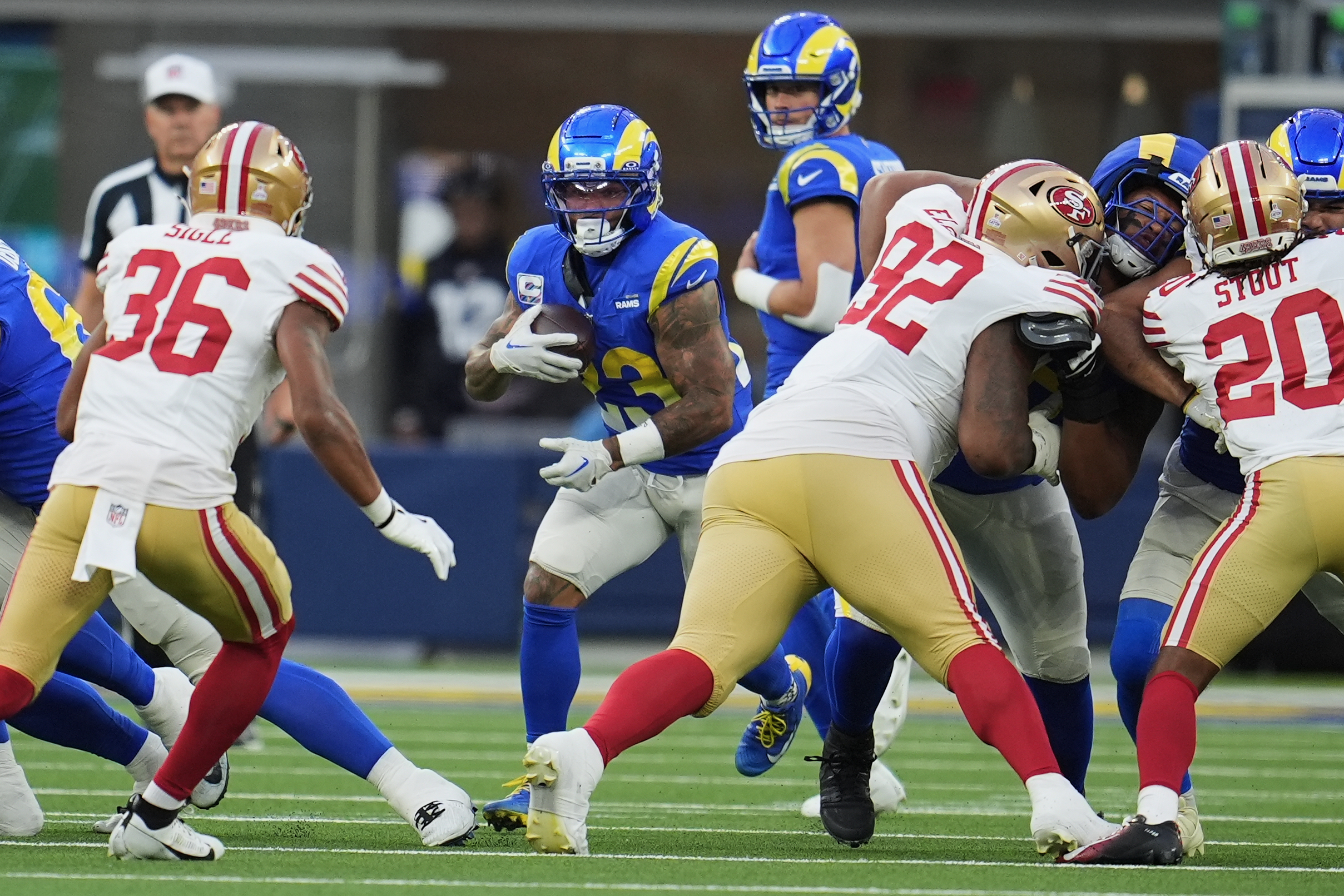 Rams running back Kyren Williams, middle, runs against the San...