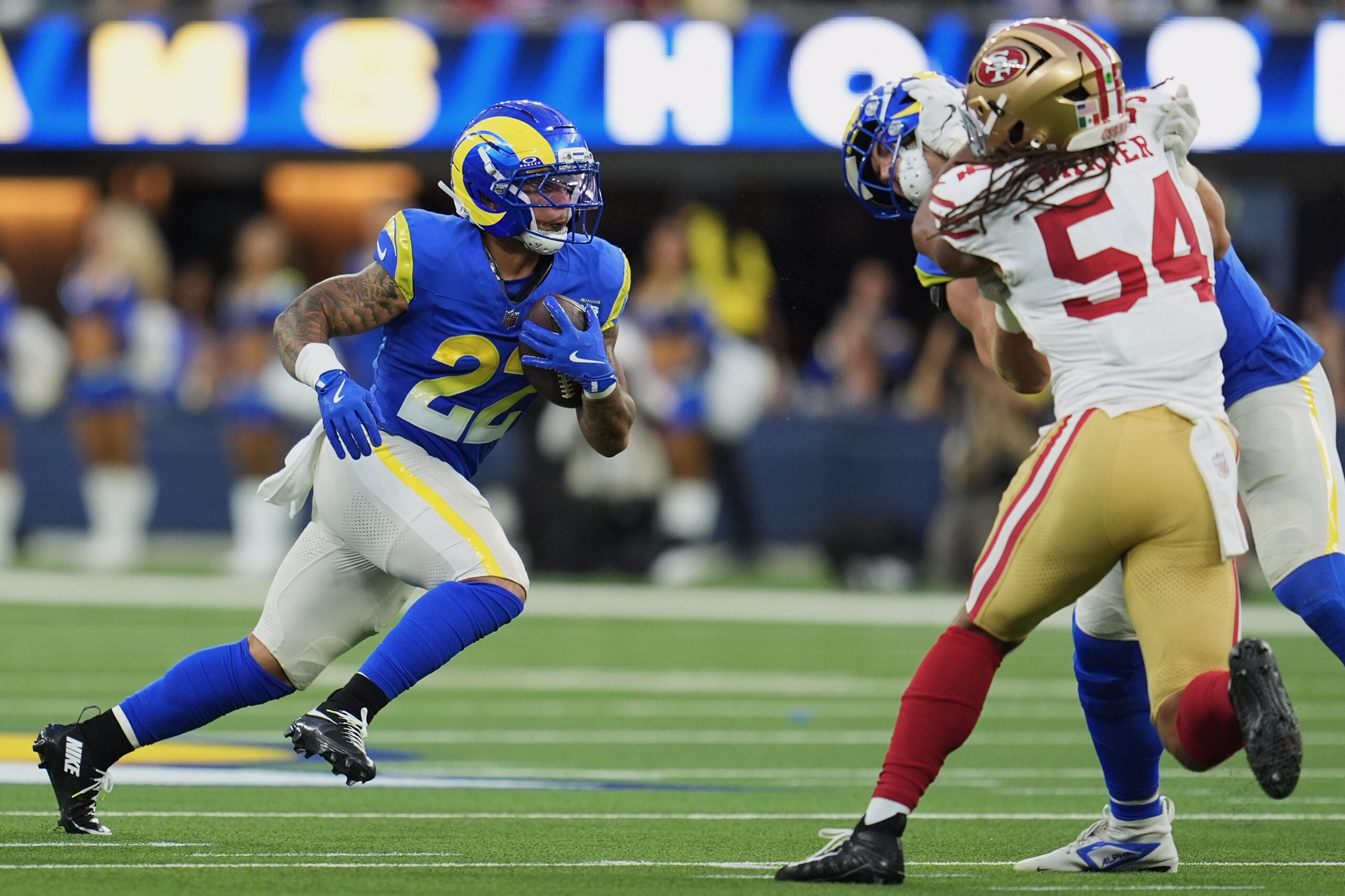 Rams running back Blake Corum (22) runs against the San...