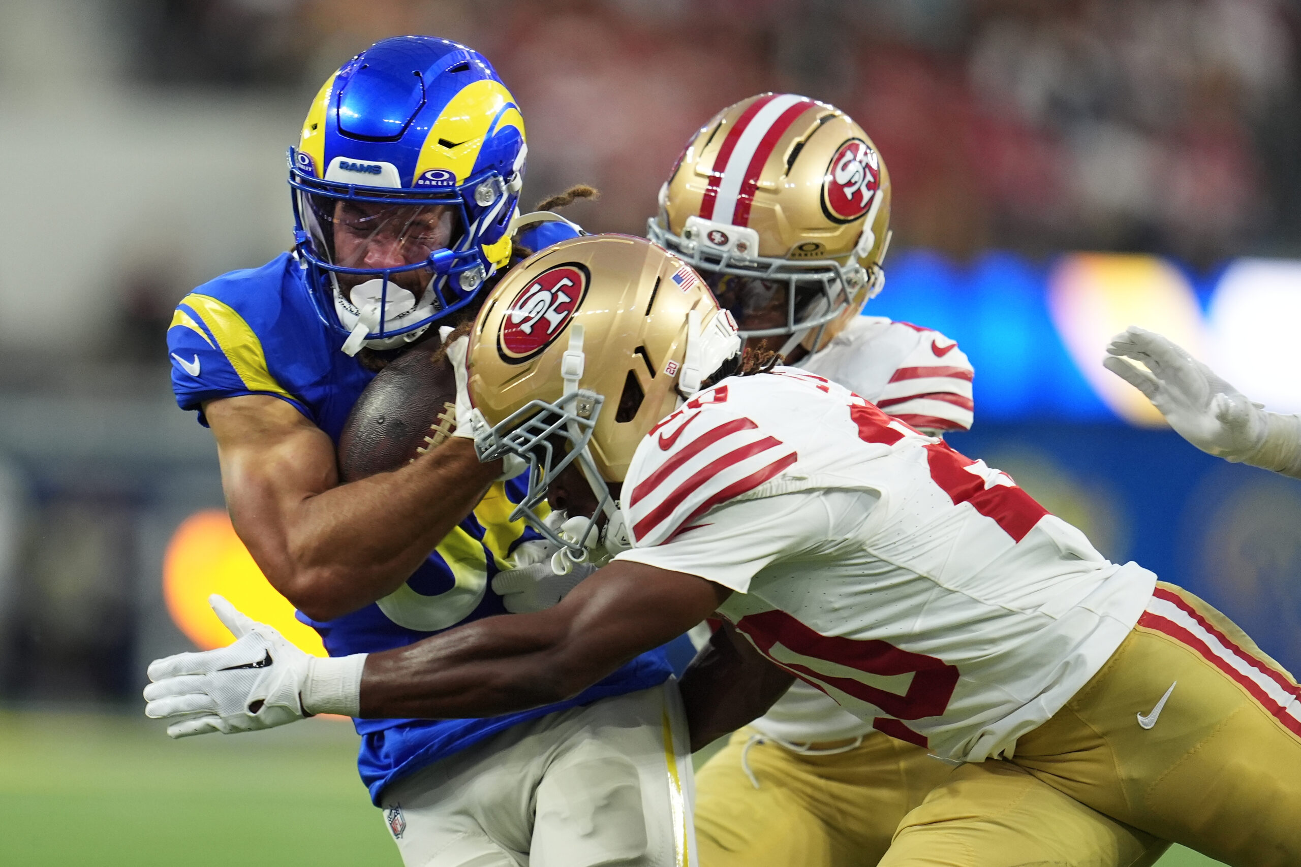 Rams wide receiver Jordan Whittington, left, runs against San Francisco...