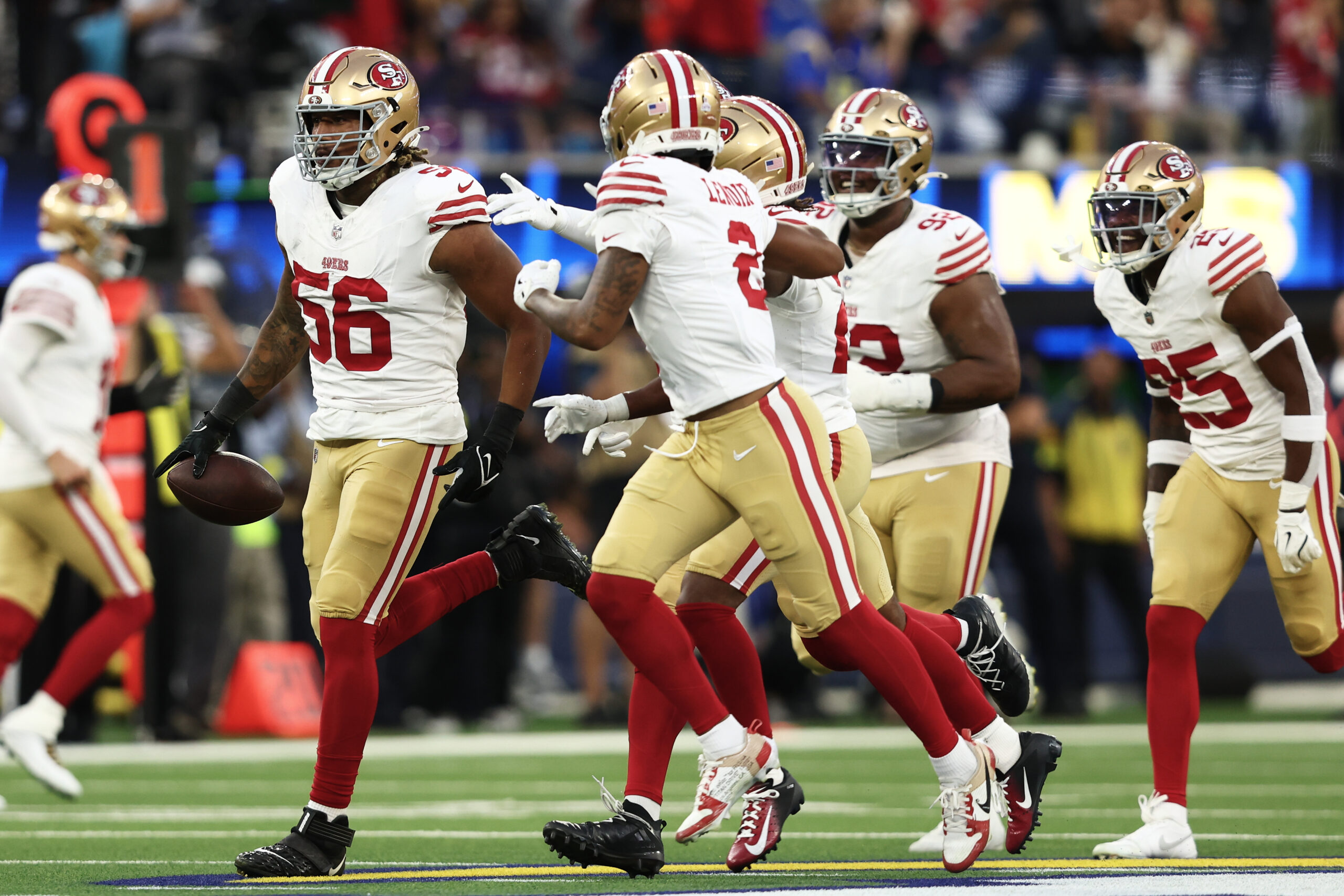 San Francisco 49ers linebacker Trevis Gipson (56) celebrates with teammates...