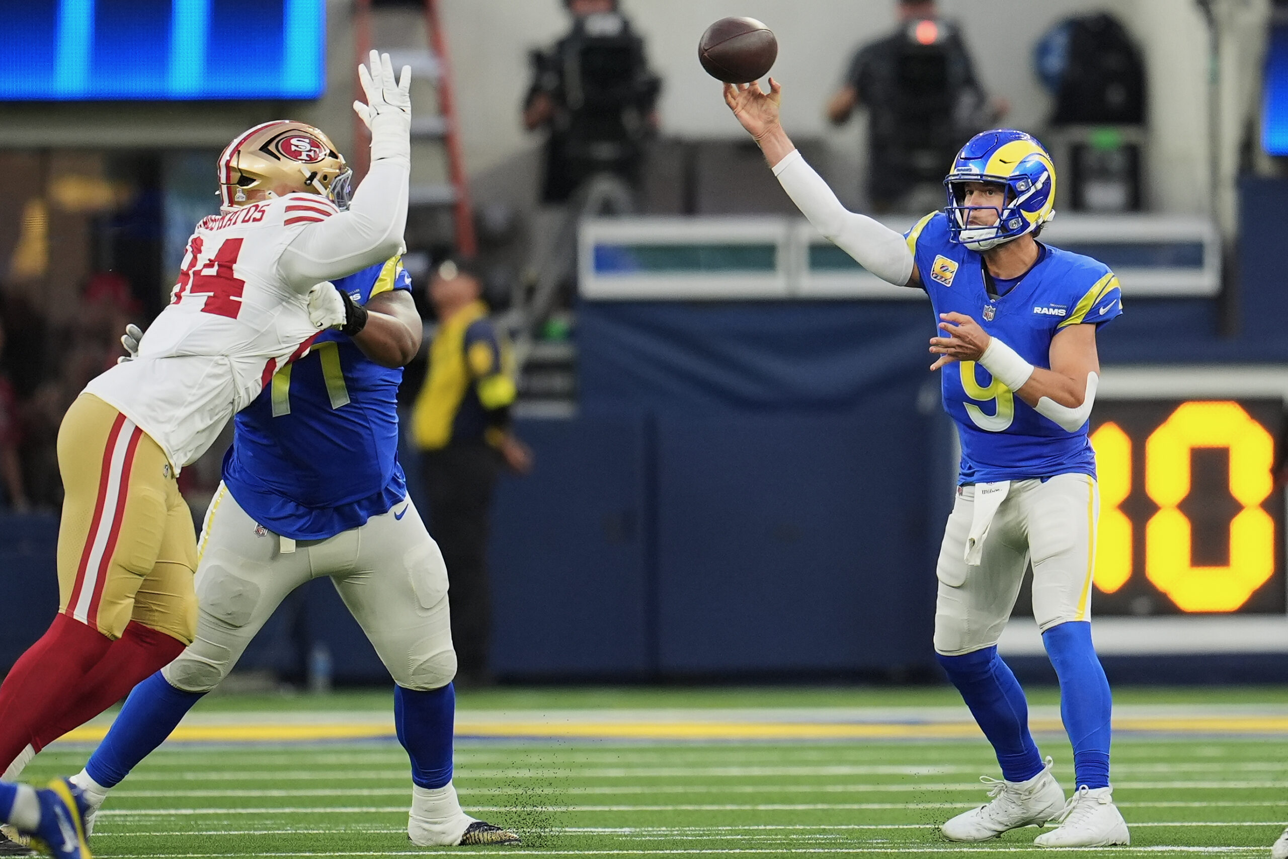 Rams quarterback Matthew Stafford (9) passes as San Francisco 49ers...