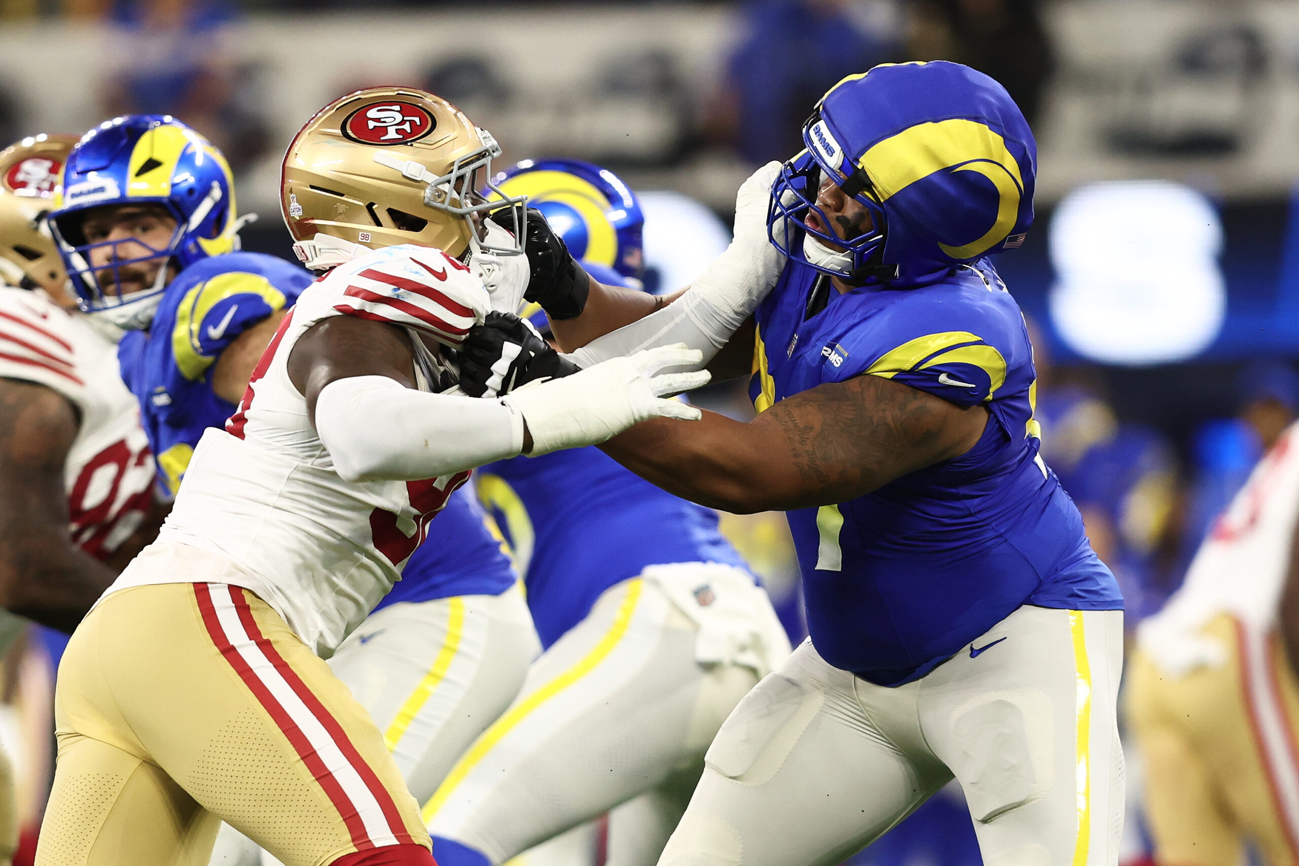 San Francisco 49ers defensive end Mykel Williams, foreground left, rushes...