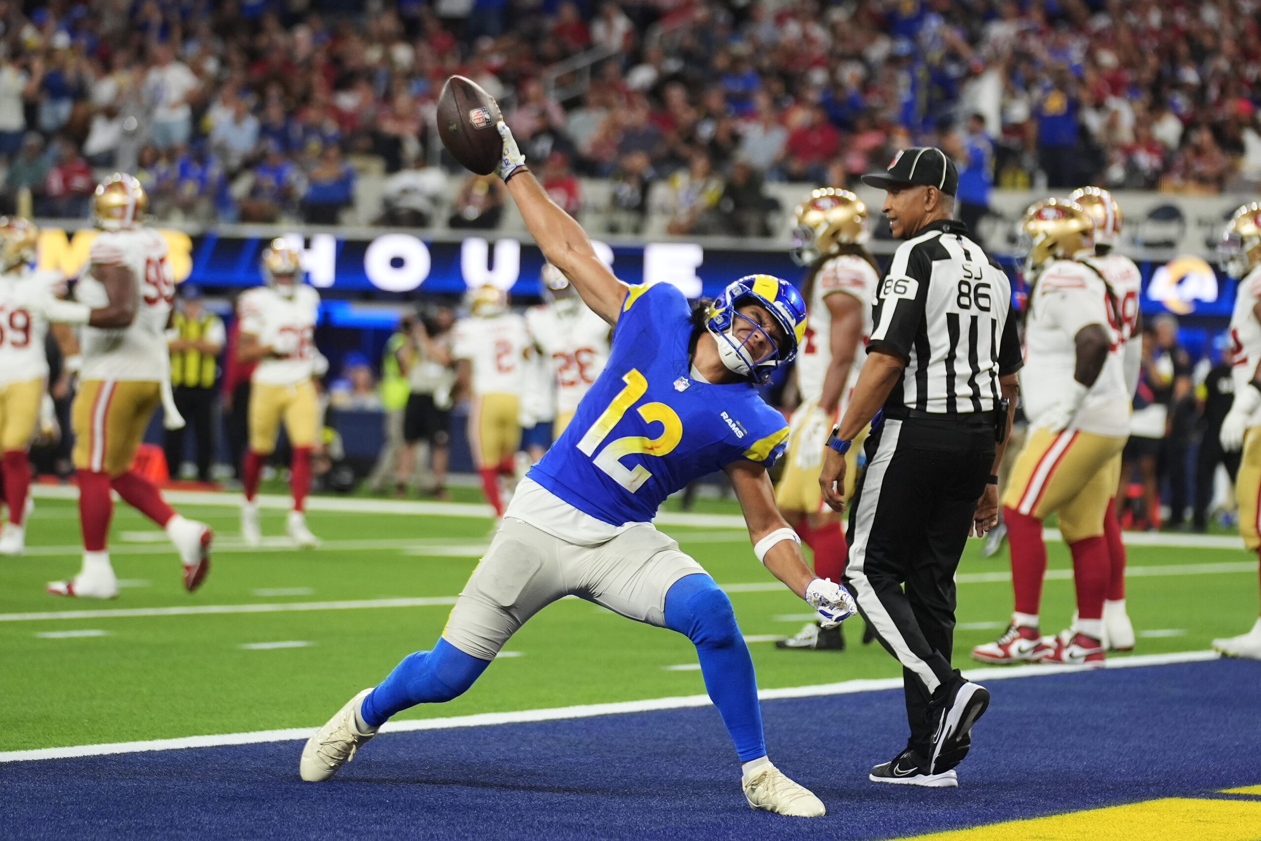 Rams wide receiver Puka Nacua (12) celebrates after scoring against...
