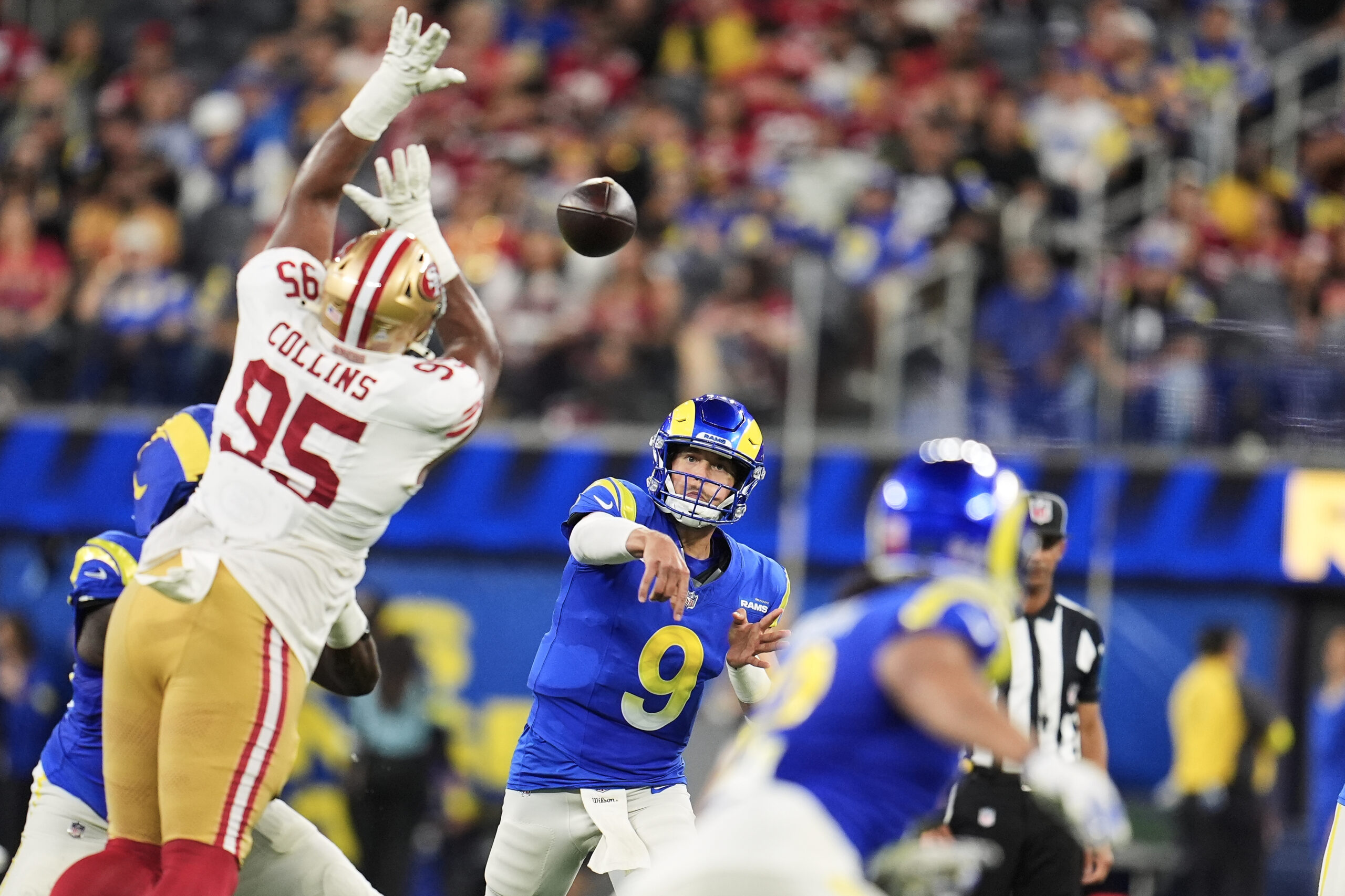 Rams quarterback Matthew Stafford (9) throws a pass past San...
