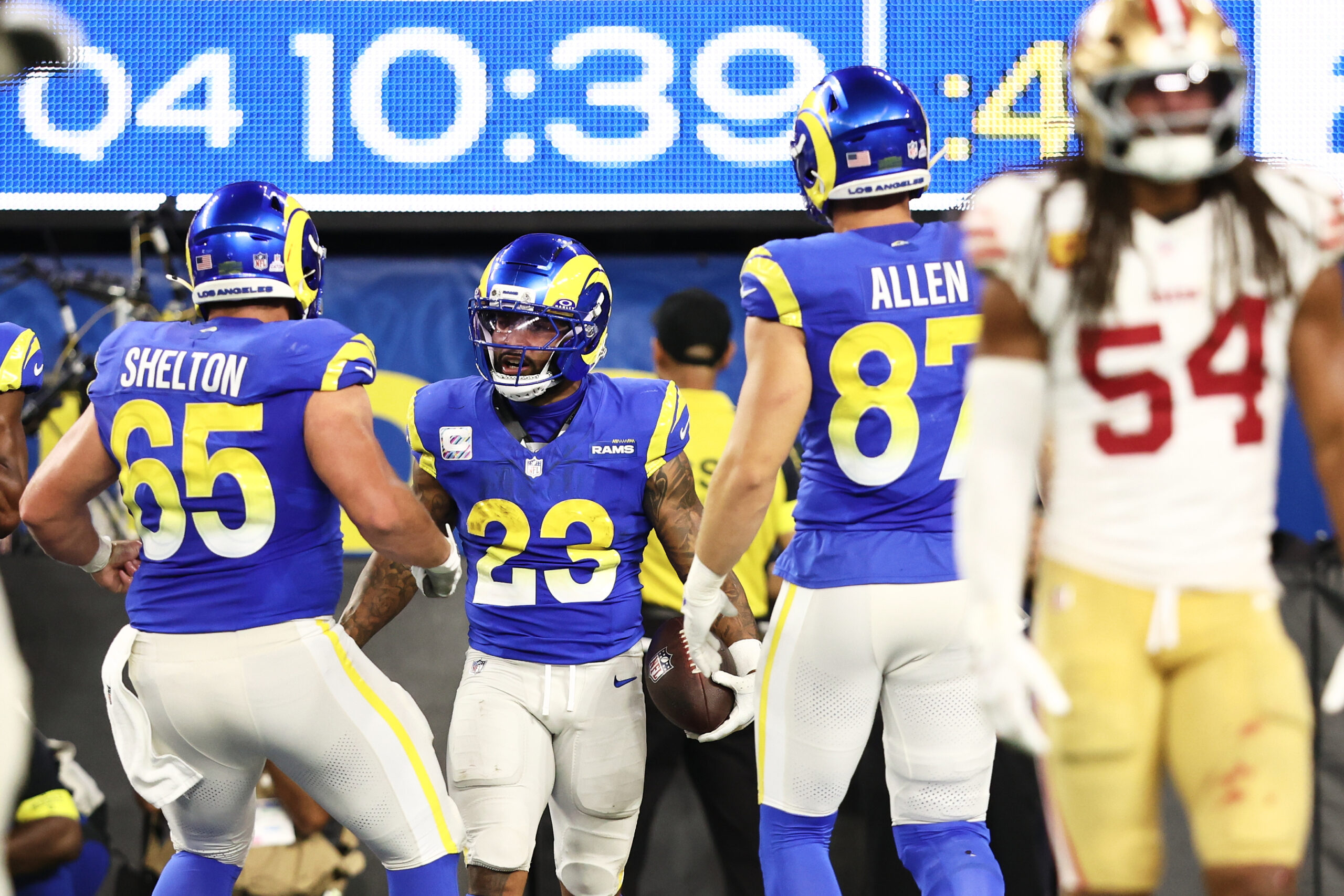 Rams running back Kyren Williams (23) is congratulated by center...