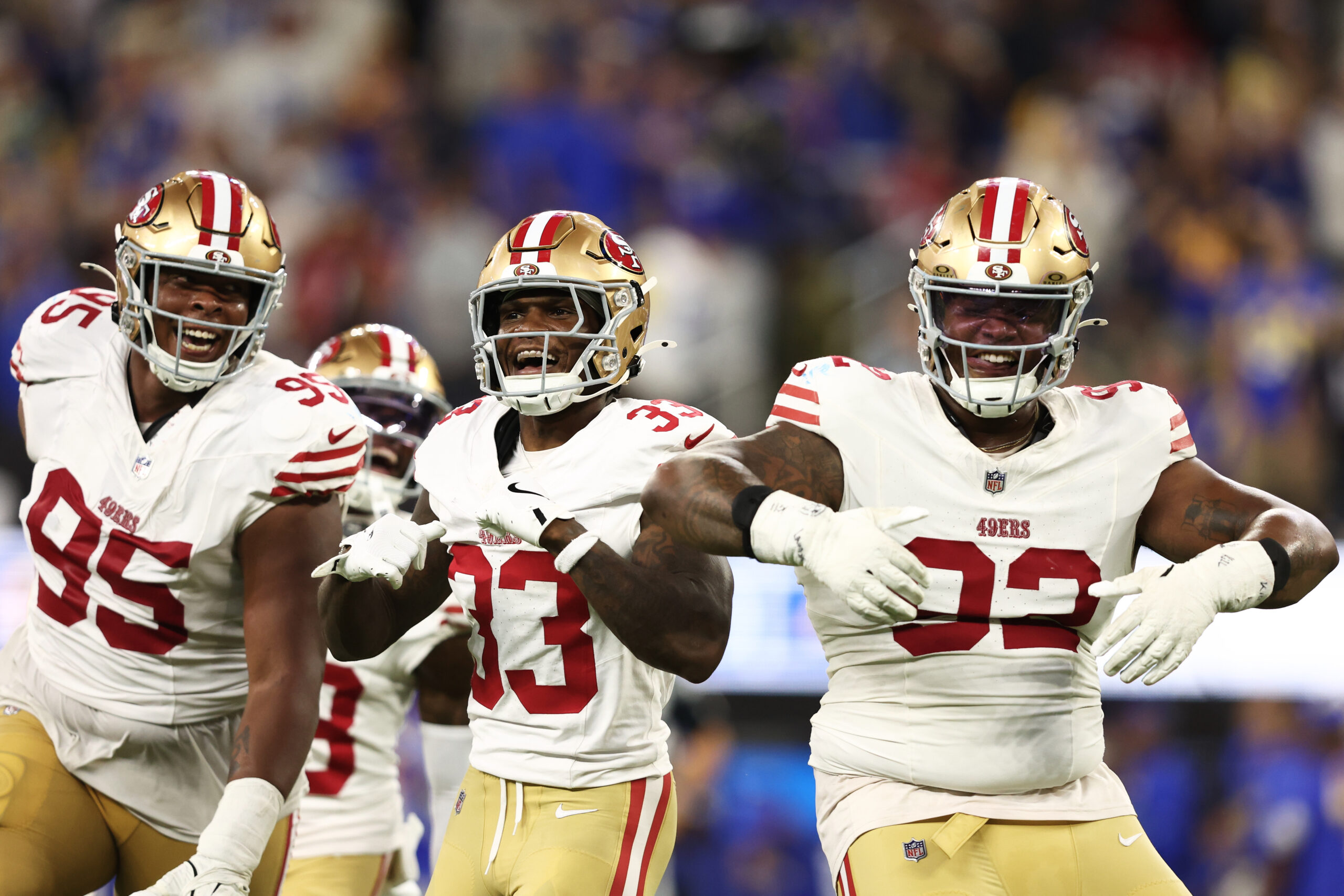 San Francisco 49ers defensive tackle Jordan Elliott, right, celebrates after...