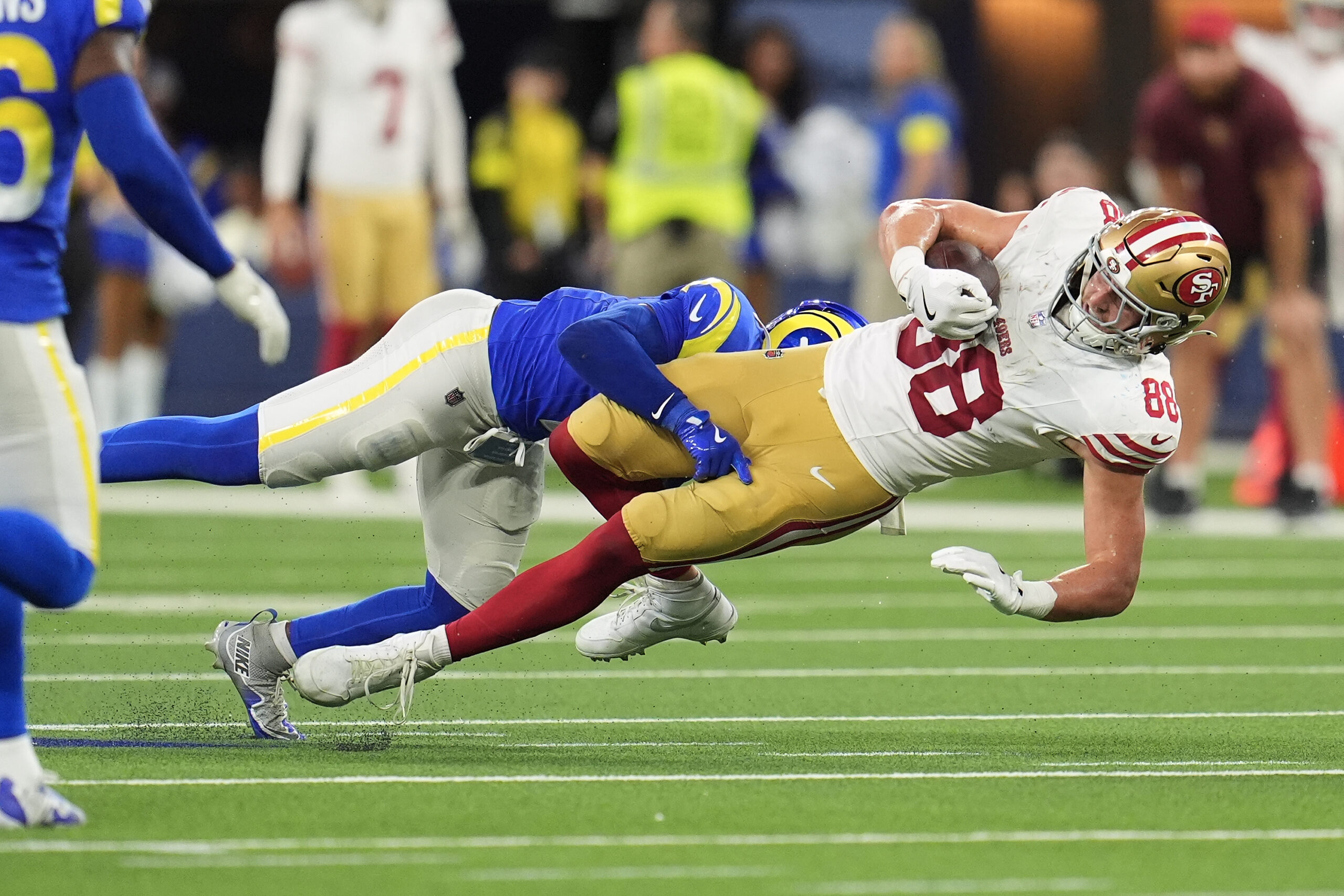 San Francisco 49ers tight end Jake Tonges (88) is tackled...