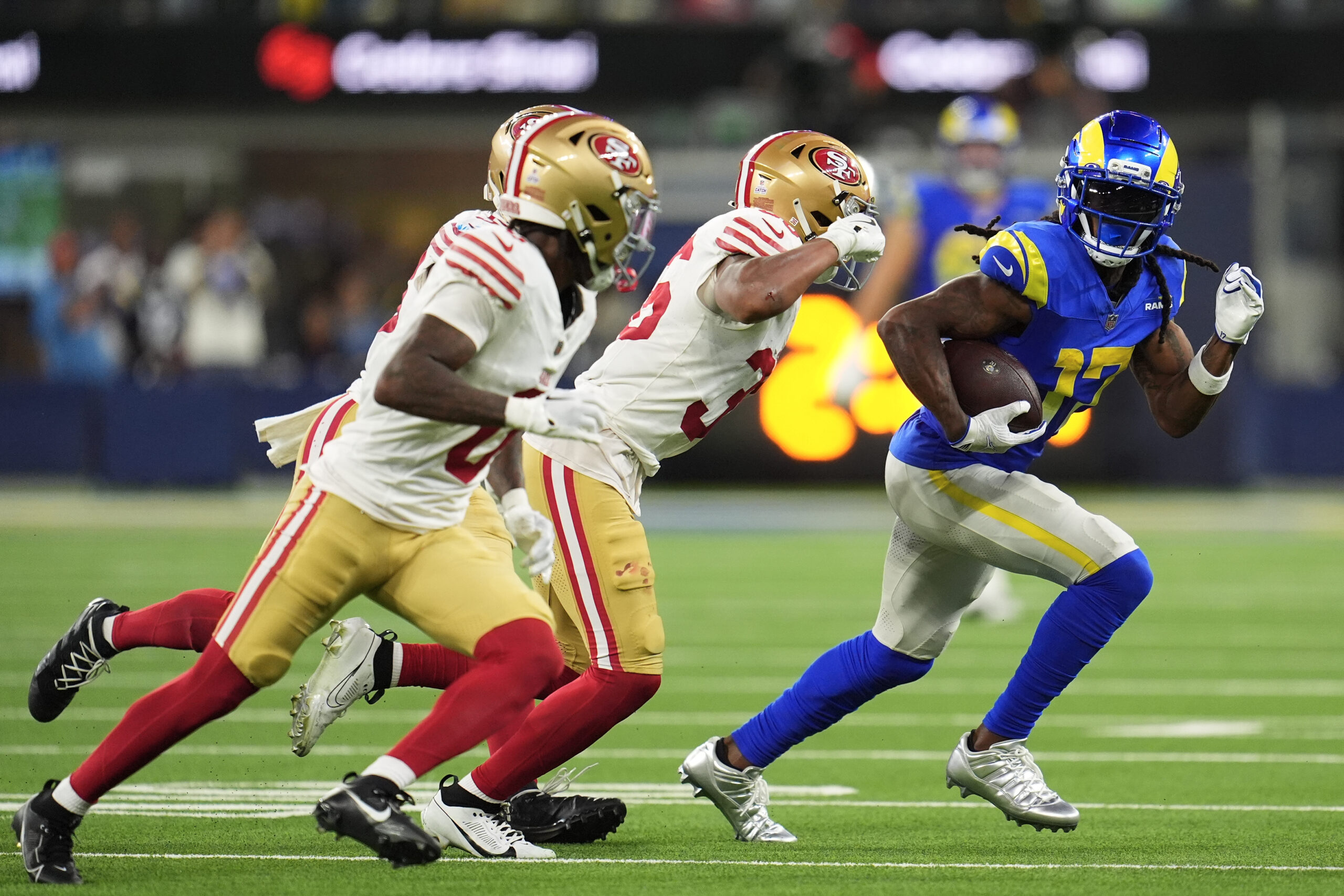 Rams wide receiver Davante Adams, right, runs against the San...