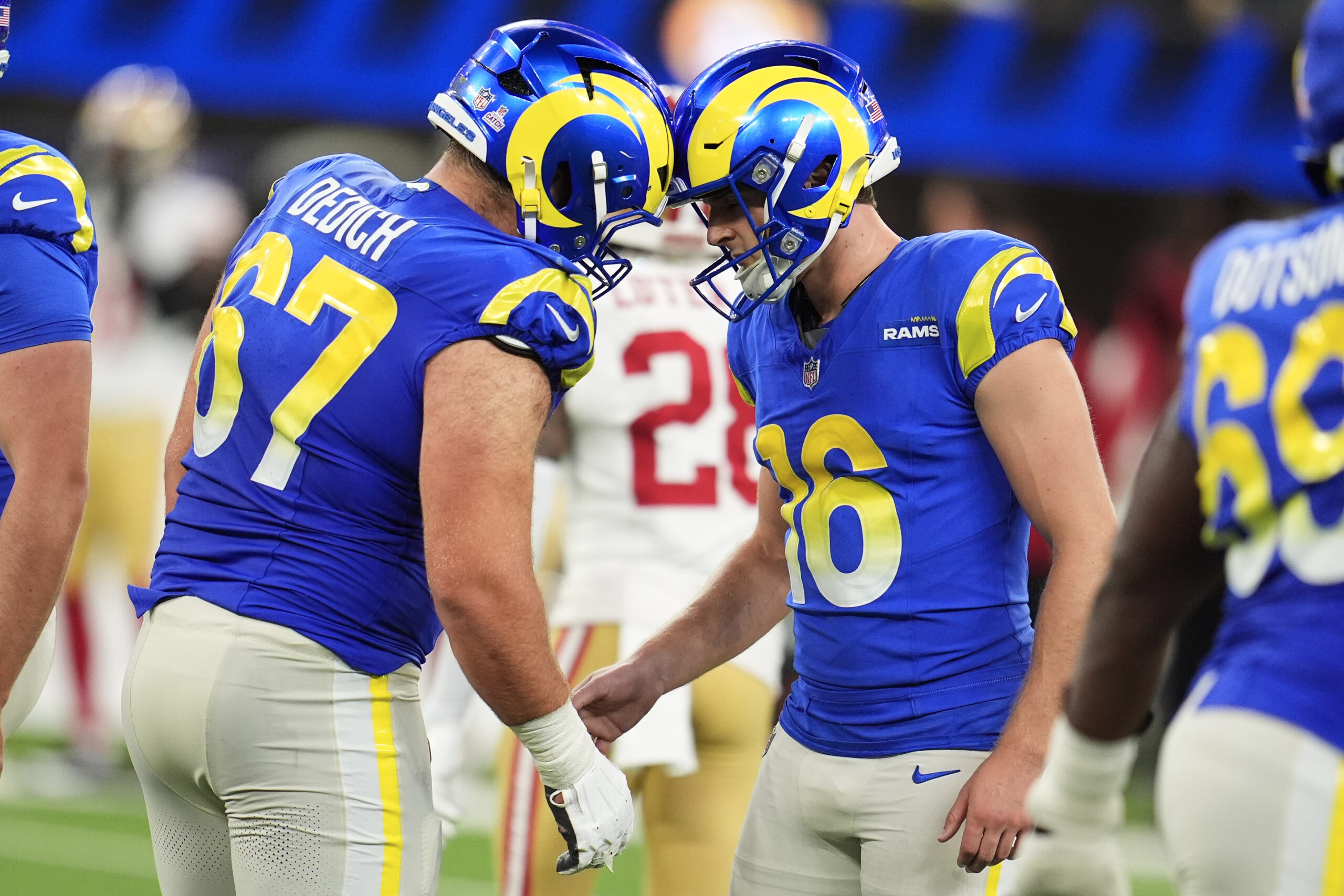 Rams kicker Joshua Karty (16) is congratulated by offensive lineman...
