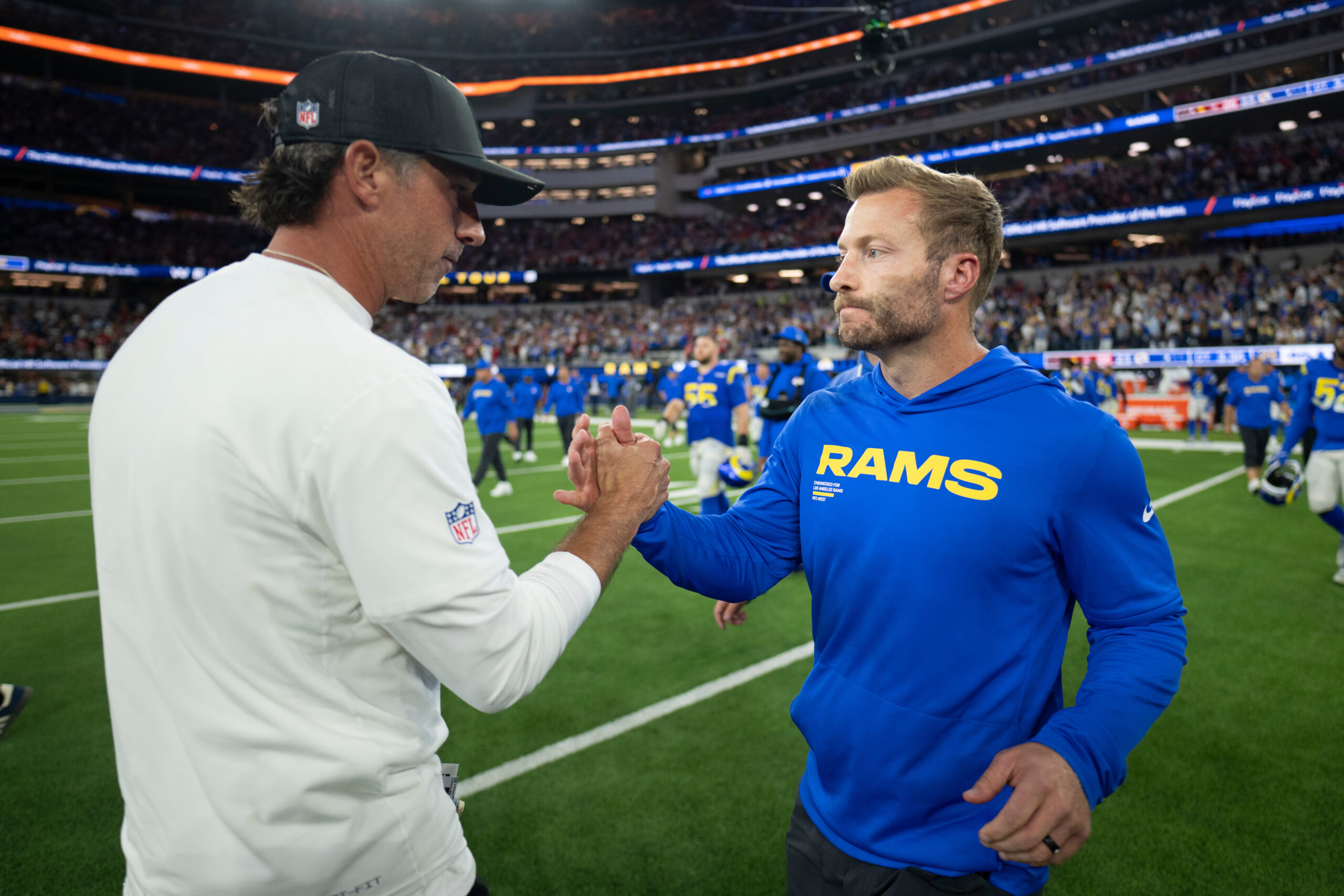 Rams head coach Sean McVay, right, and San Francisco 49ers...