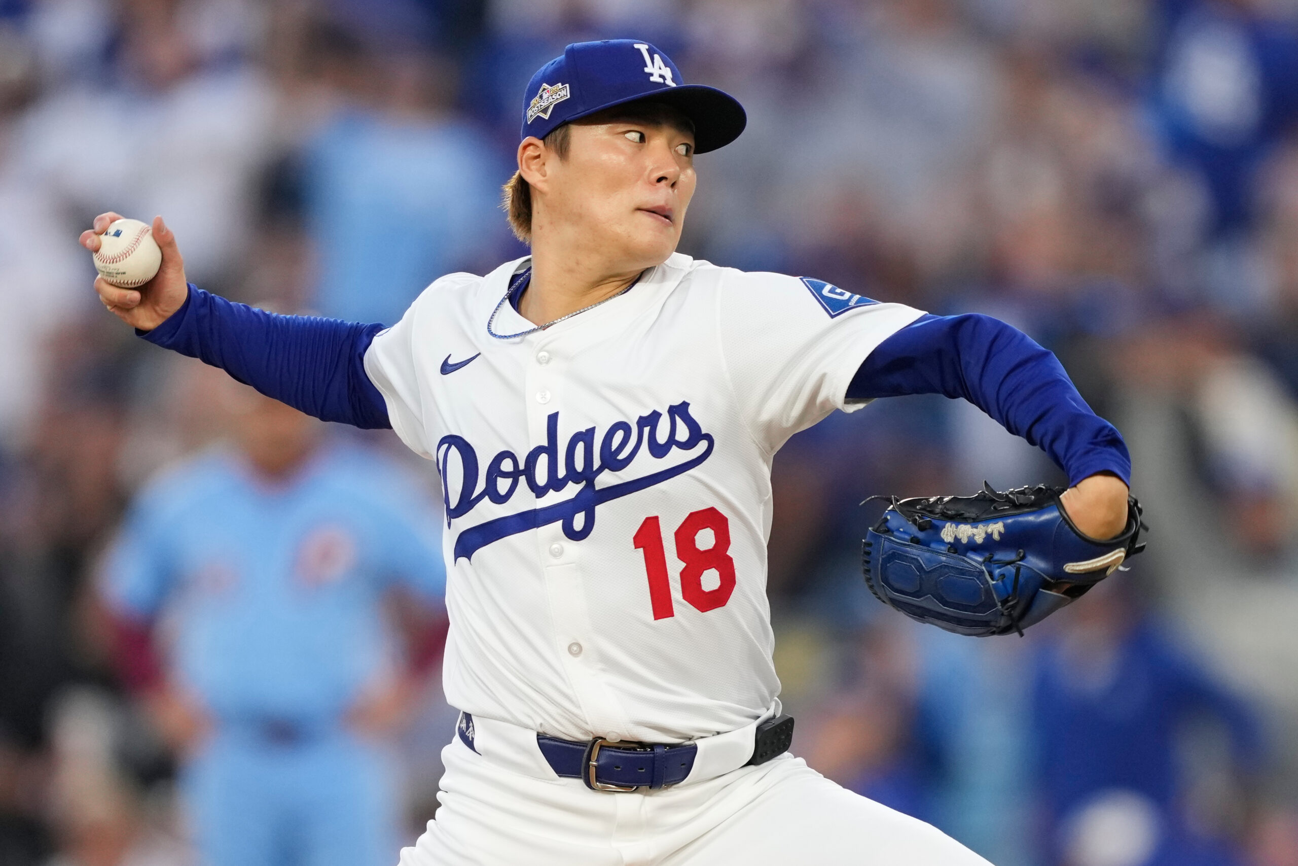 Dodgers starting pitcher Yoshinobu Yamamoto throws to a Philadelphia Phillies...
