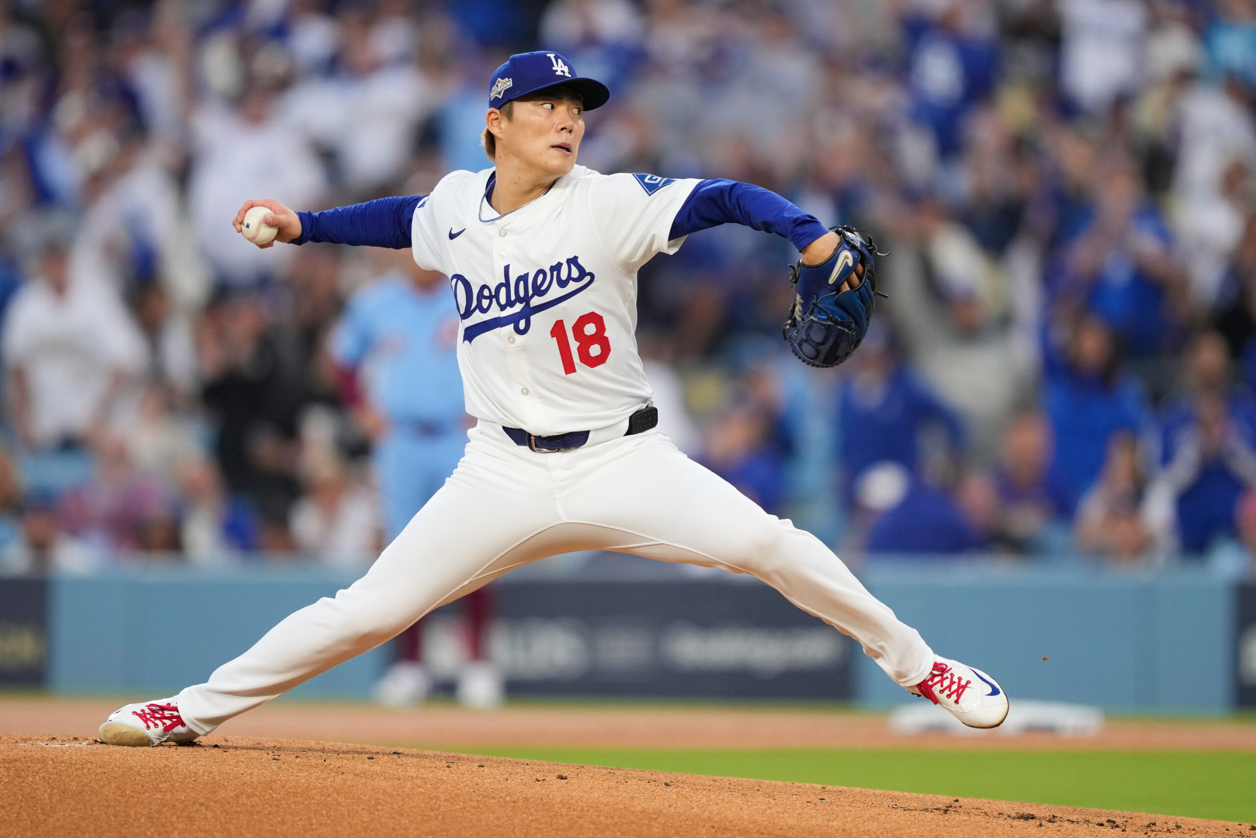 Dodgers starting pitcher Yoshinobu Yamamoto throws to a Philadelphia Phillies...