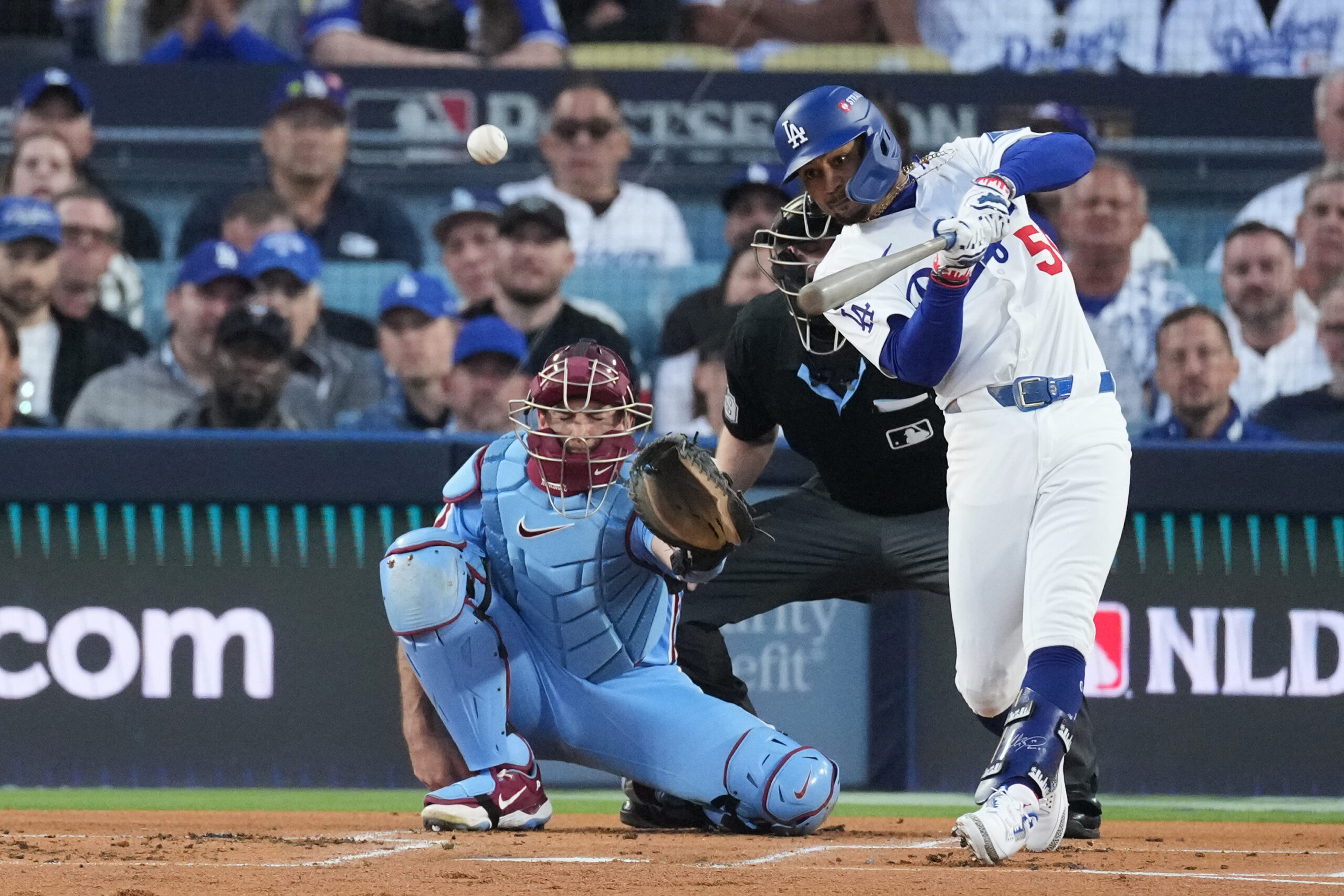 The Dodgers’ Mookie Betts connects for a triple during the...