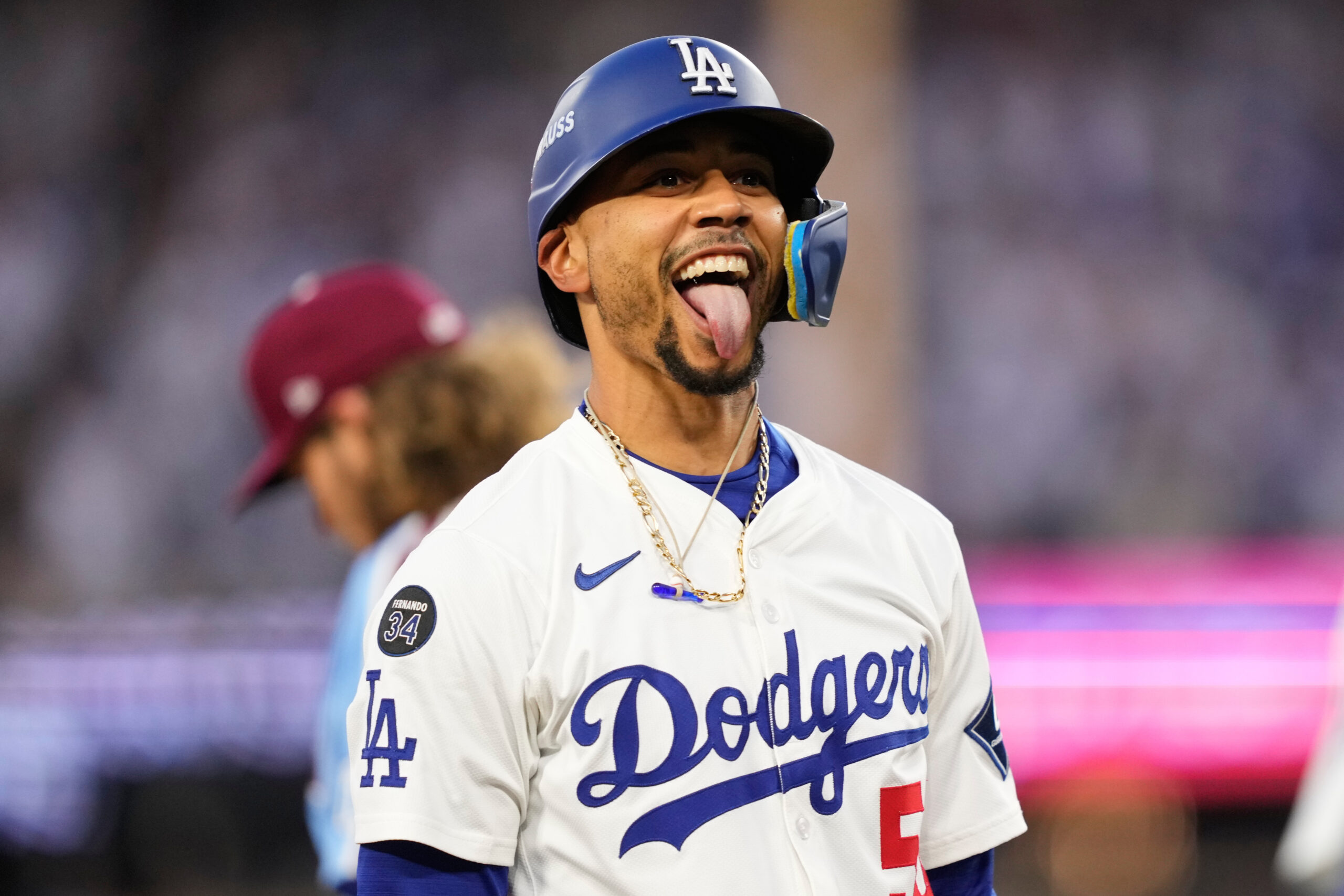 The Dodgers’ Mookie Betts reacts after hitting a triple during...