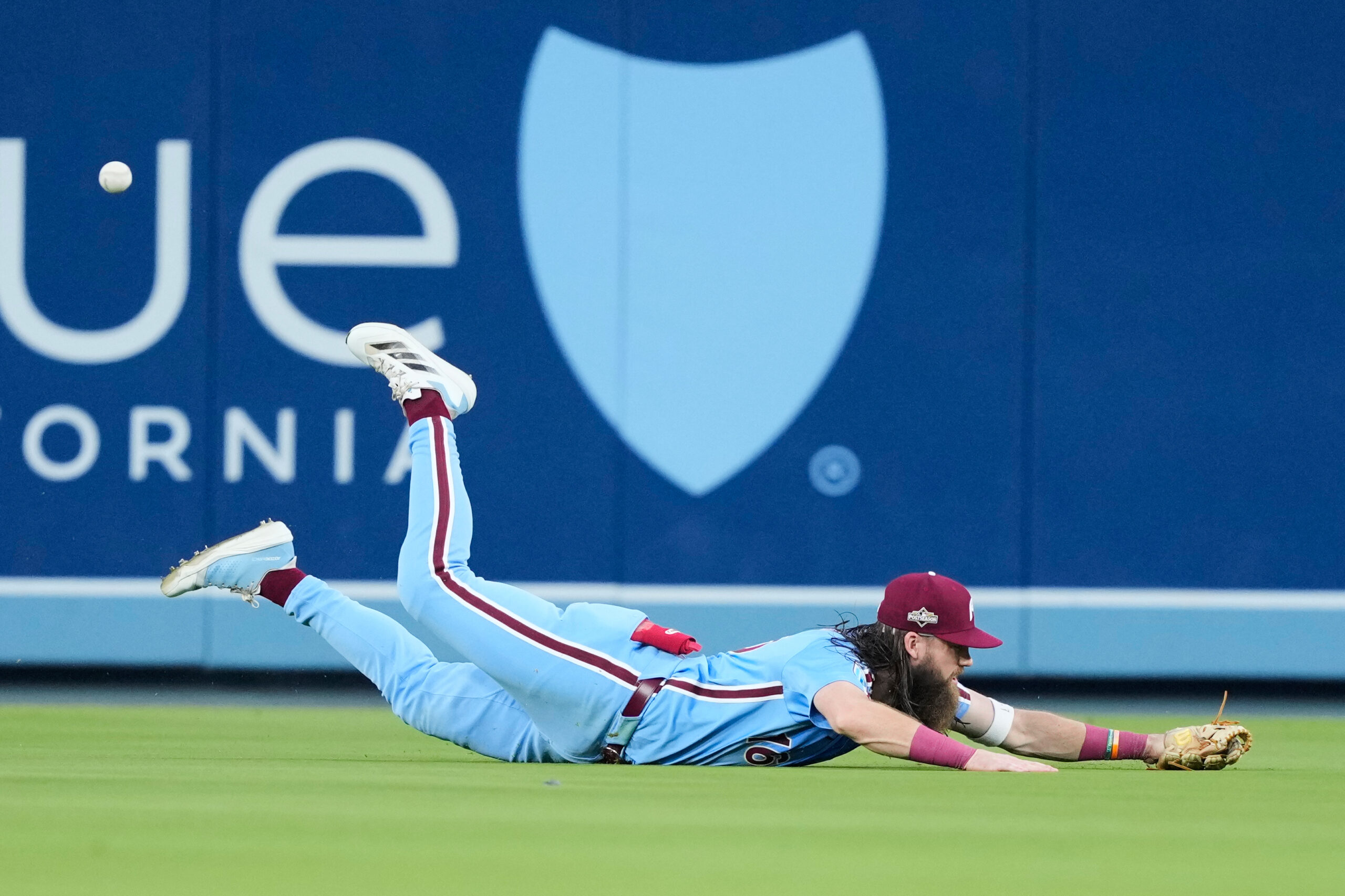 Philadelphia Phillies center fielder Brandon Marsh dives but can’t catch...