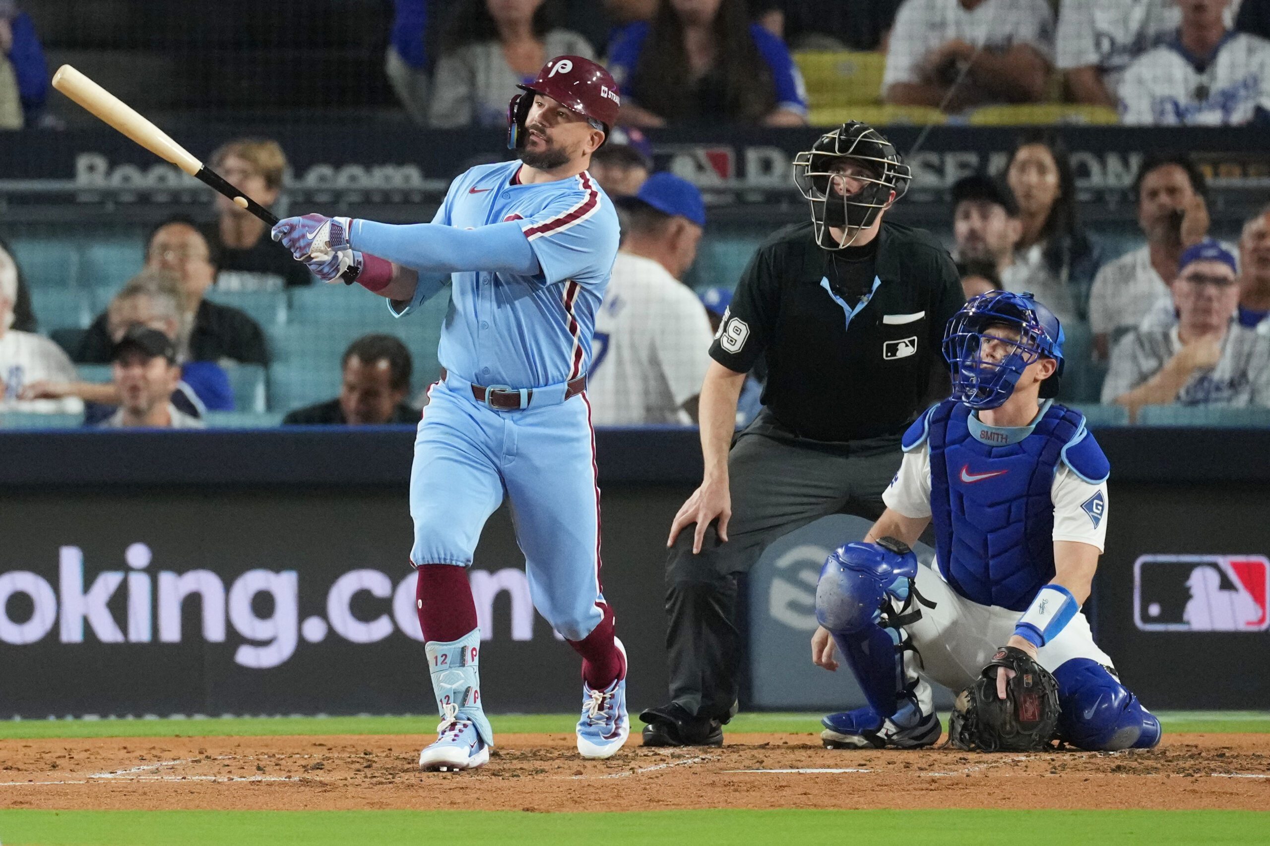 The Philadelphia Phillies’ Kyle Schwarber Watches the flight of his...
