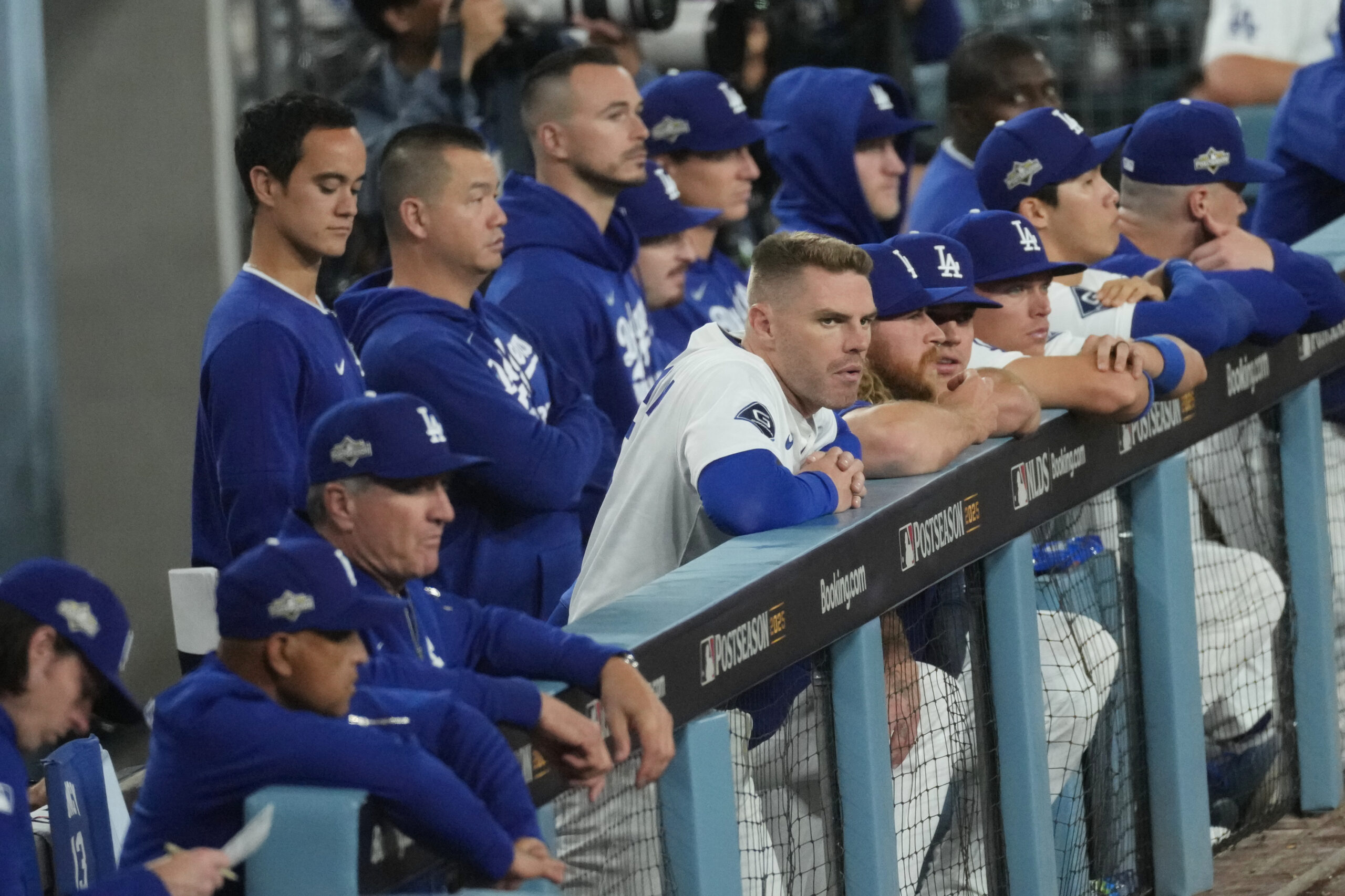 The Dodgers watch from the dugout during the ninth inning...
