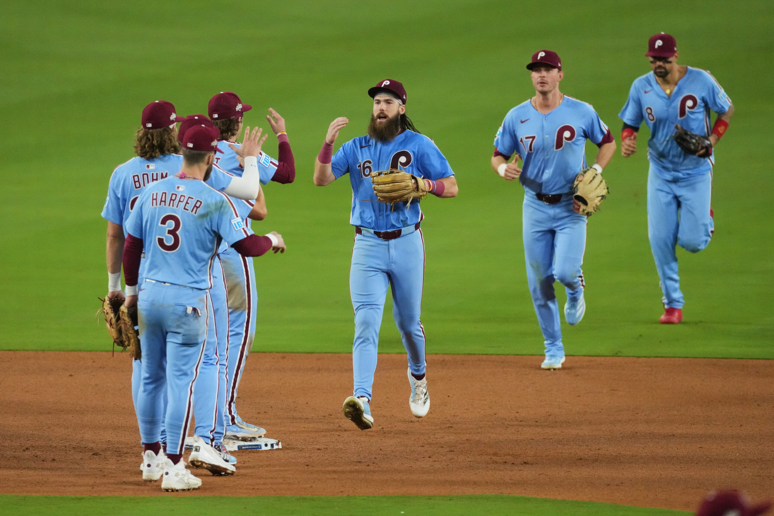 The Philadelphia Phillies celebrate after their 8-2 victory over the...