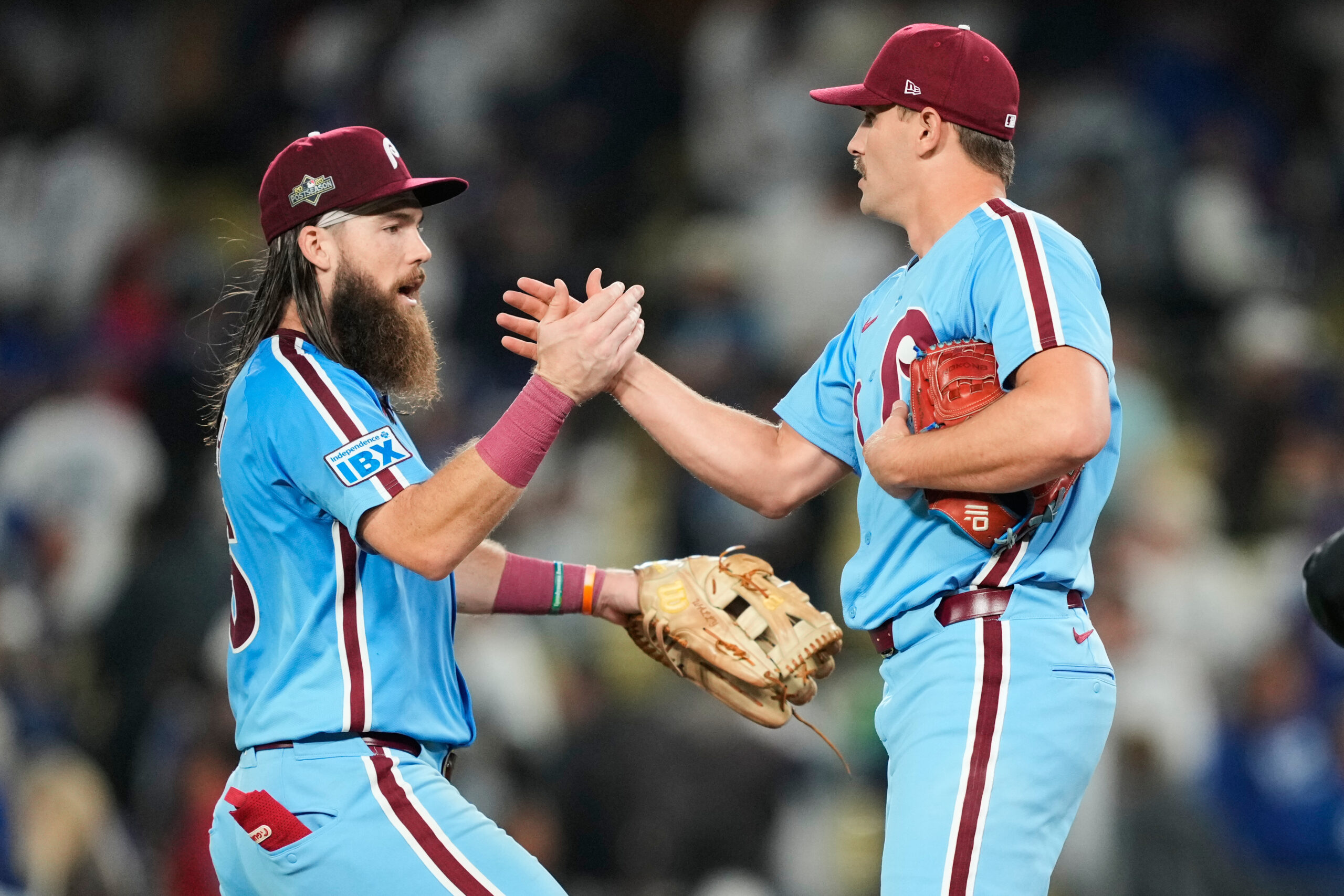Philadelphia Phillies relief pitcher Tanner Banks shakes hands with center...