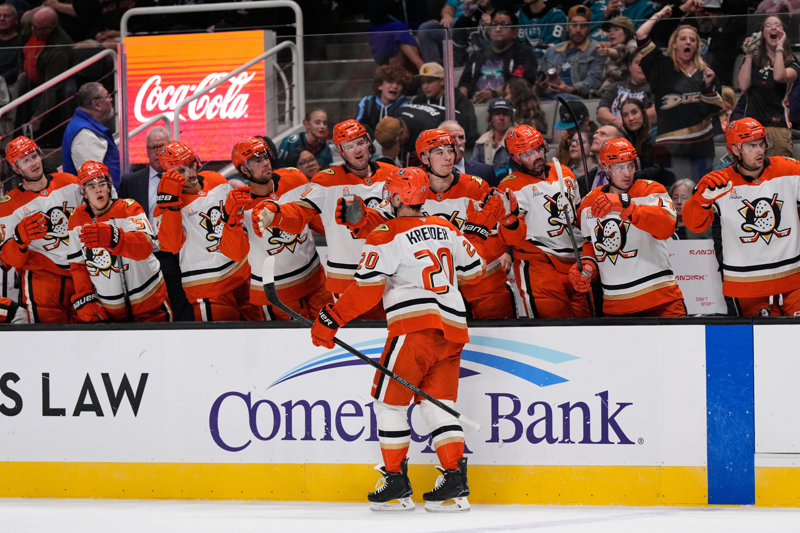 Ducks left wing Chris Kreider (20) celebrates with teammates after...