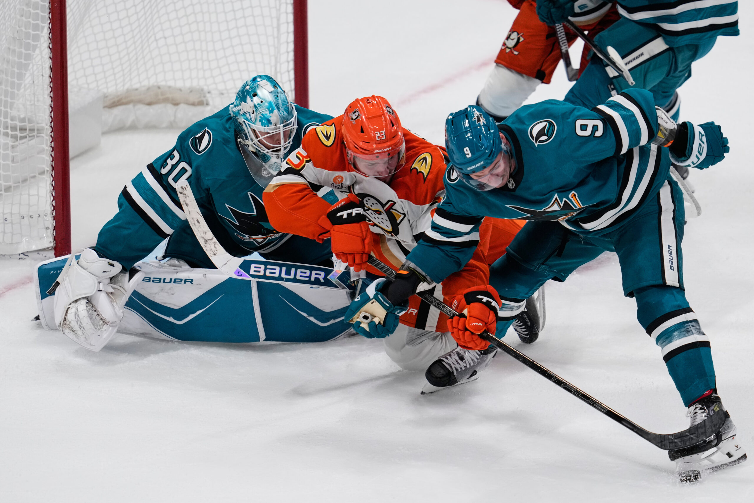 Ducks center Mason McTavish (23) and San Jose Sharks defenseman...