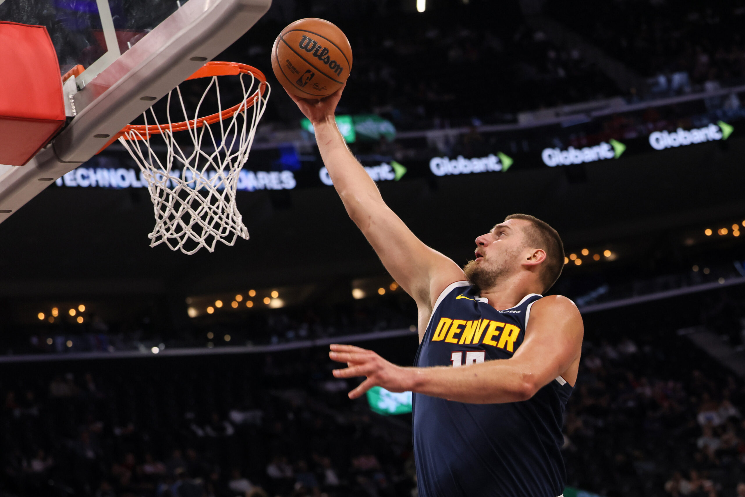 Denver Nuggets center Nikola Jokic scores during the first half...