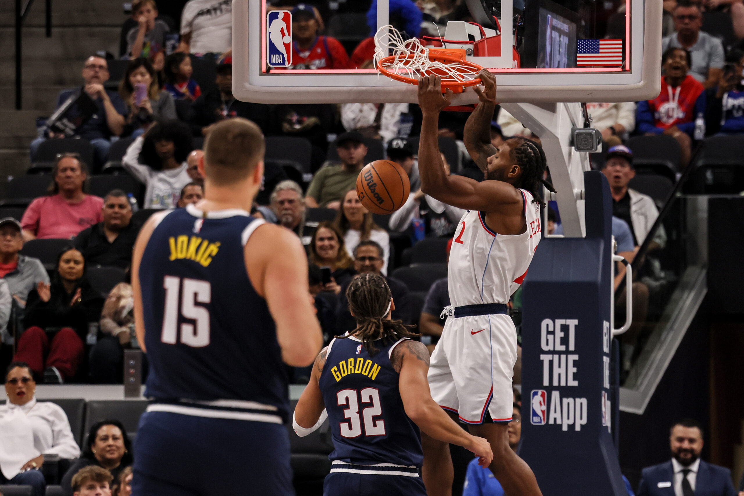 Clippers forward Kawhi Leonard scores during the first half of...