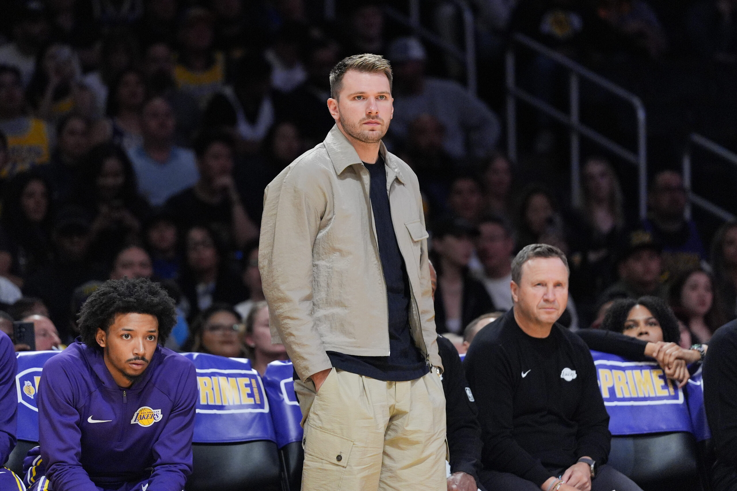 Lakers’ Luka Doncic watches action during the first half of...
