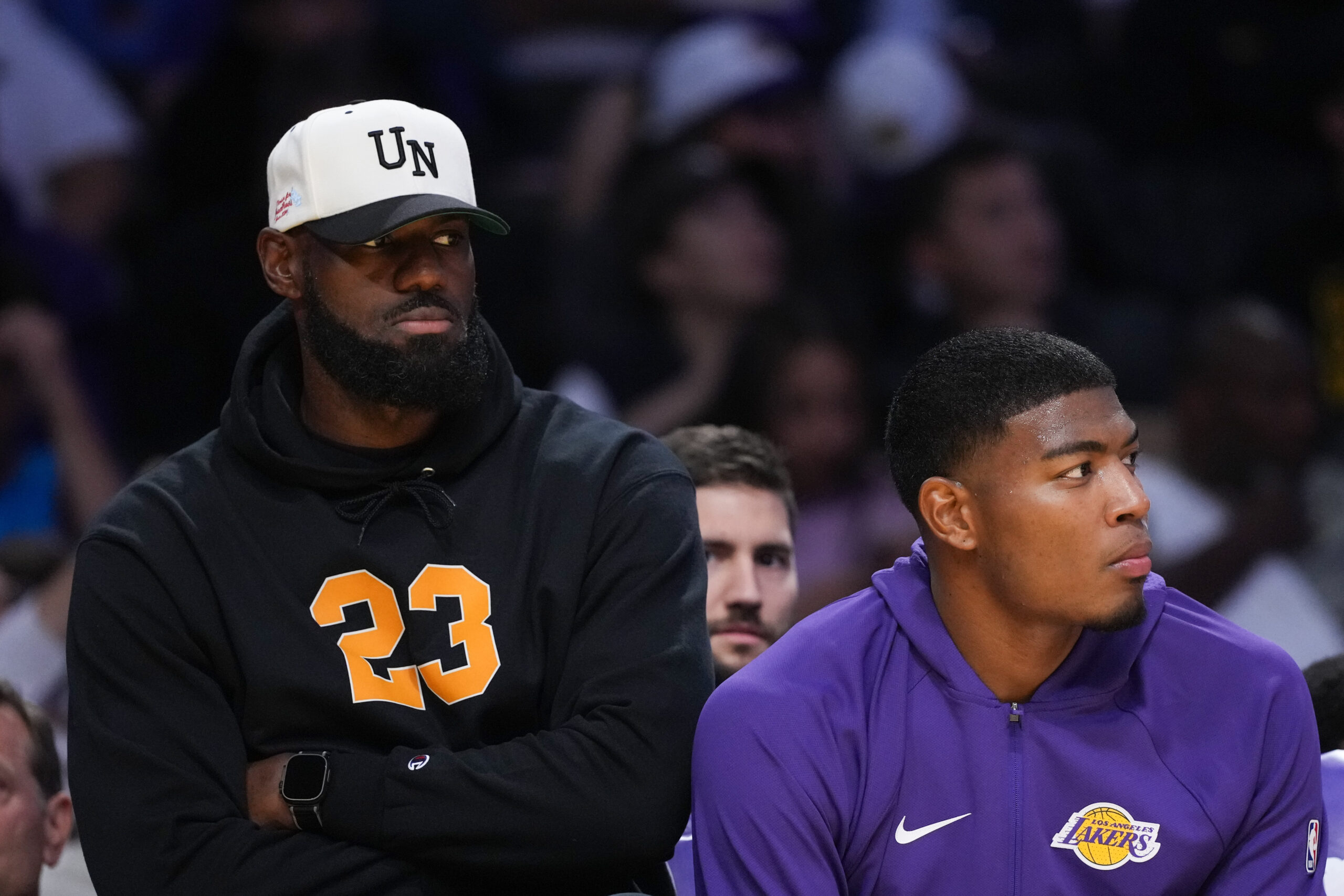 Lakers’ Lebron James, left, and Rui Hachimura watch action from...
