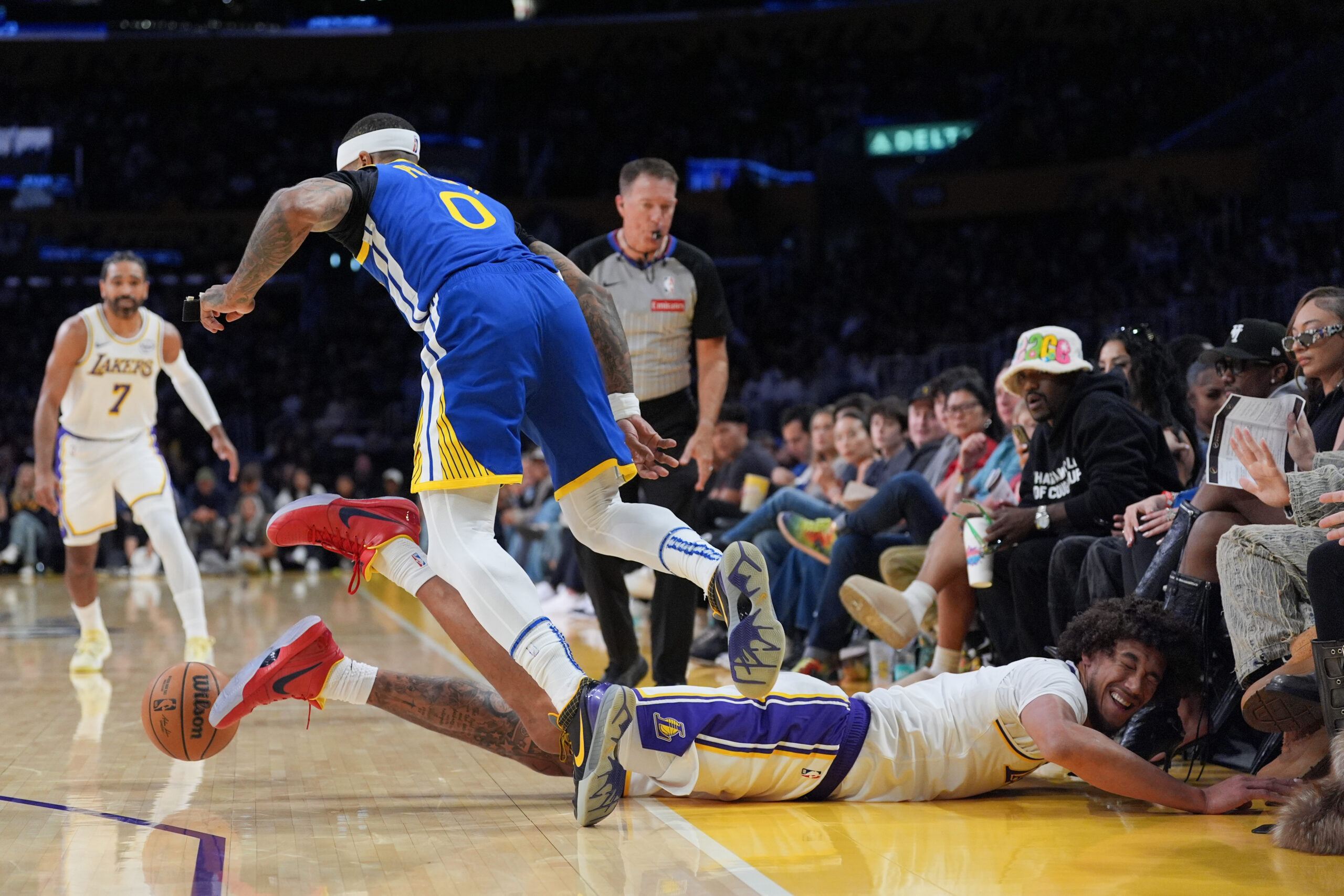 Golden State Warriors’ Gary Payton II (0) and Lakers’ Jaxson...