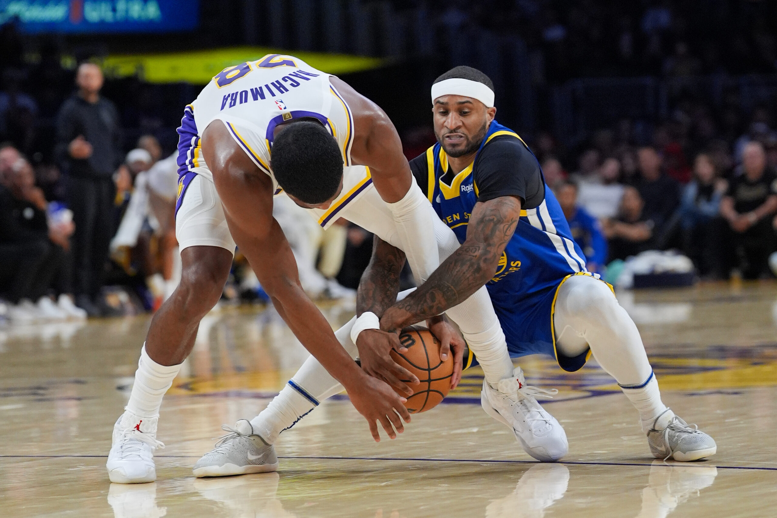 Lakers’ Rui Hachimura, left, and Golden State Warriors’ Gary Payton...