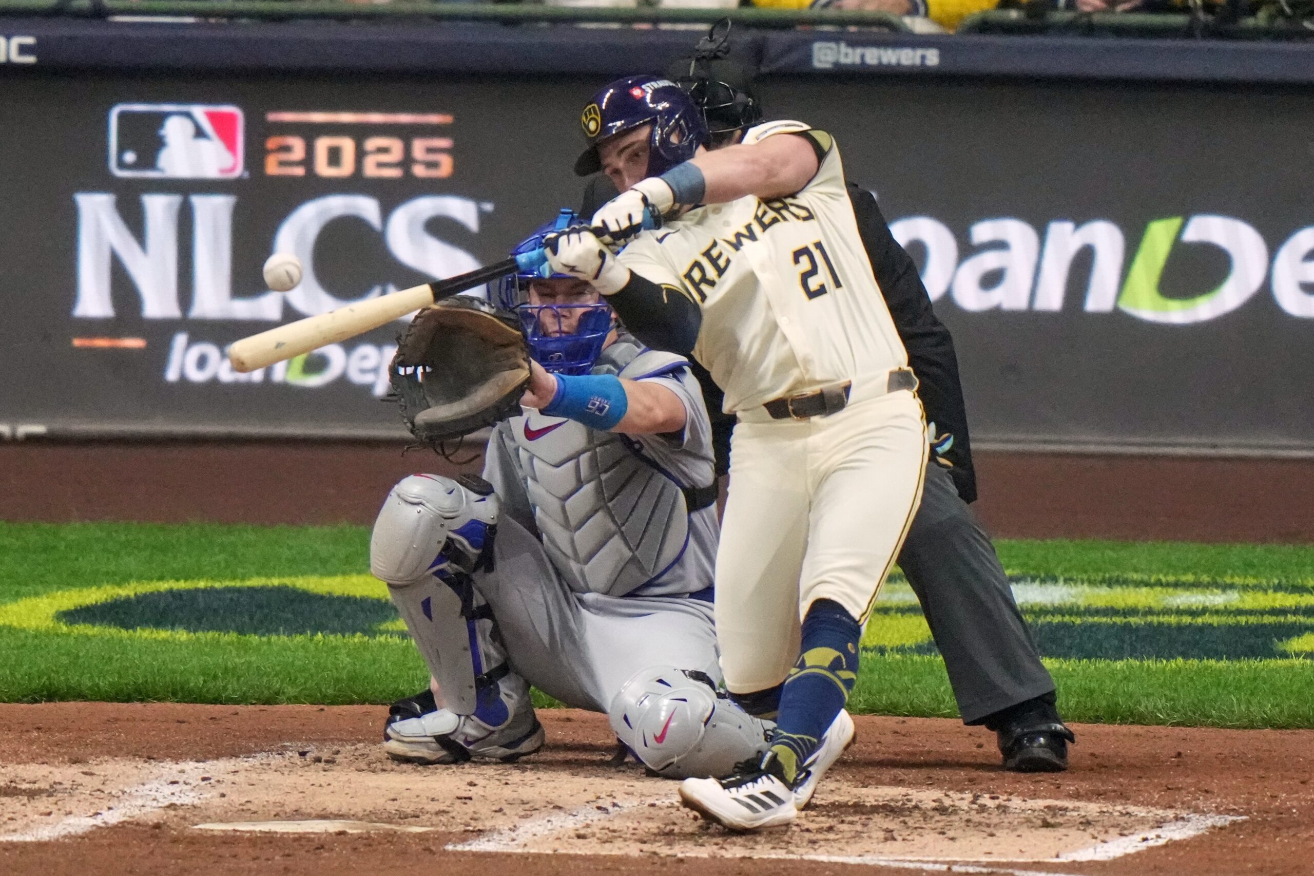The Milwaukee Brewers’ Caleb Durbin hits a single during the...