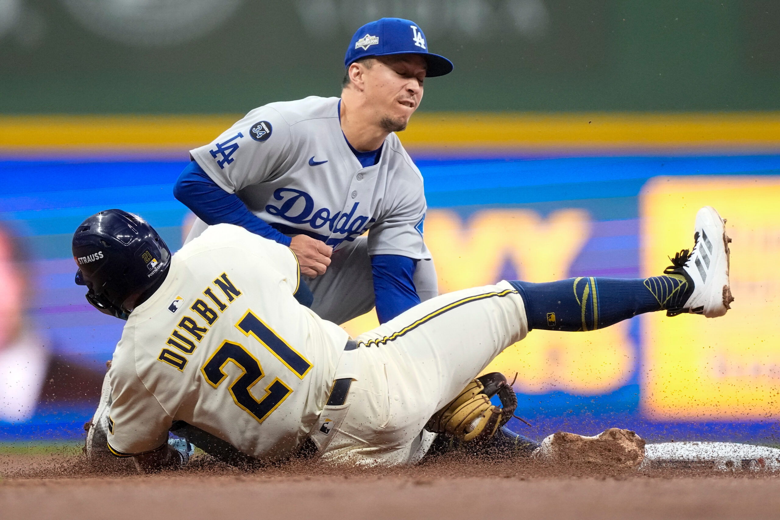 Milwaukee Brewers’ Caleb Durbin is picked off trying to steal...